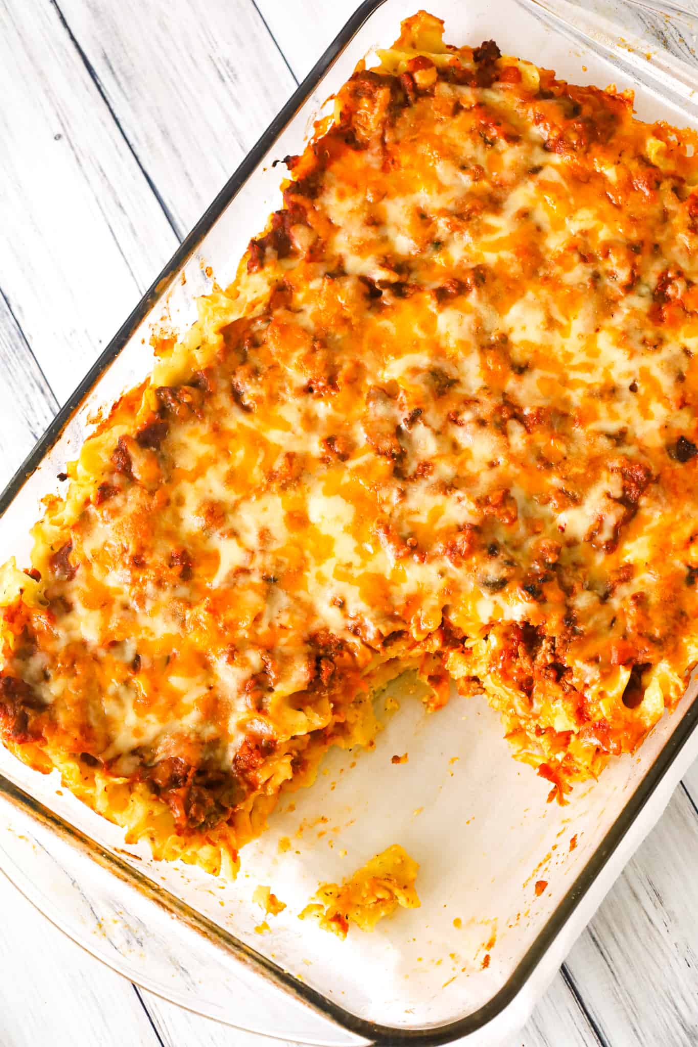 Sour Cream Noodle Bake is a hearty casserole loaded with ground beef, egg noodles, ricotta cheese, sour cream, marinara and shredded cheddar and mozzarella.