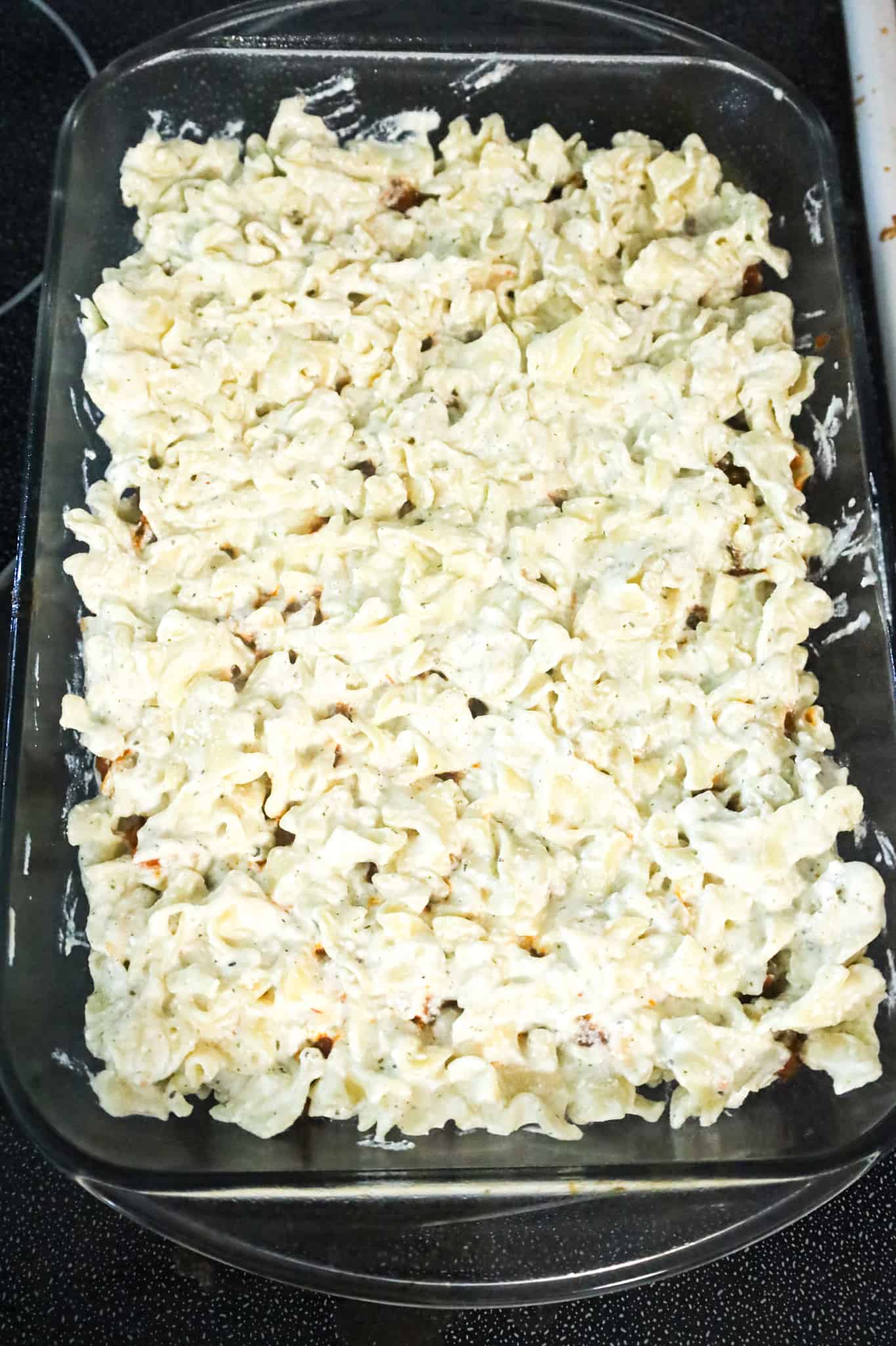 sour cream noodle mixture in a baking dish