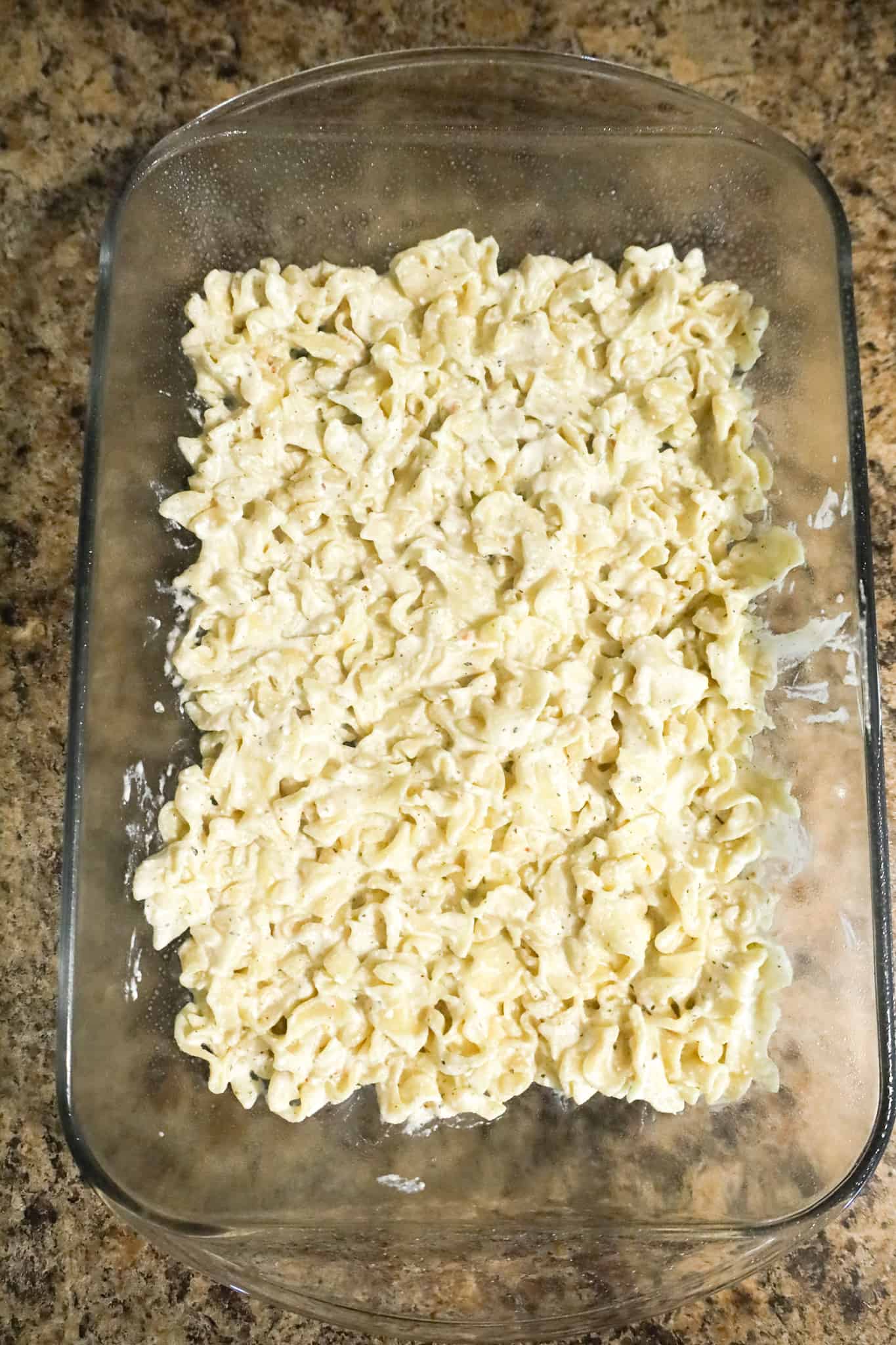 sour cream and ricotta noodle mixture in a baking dish