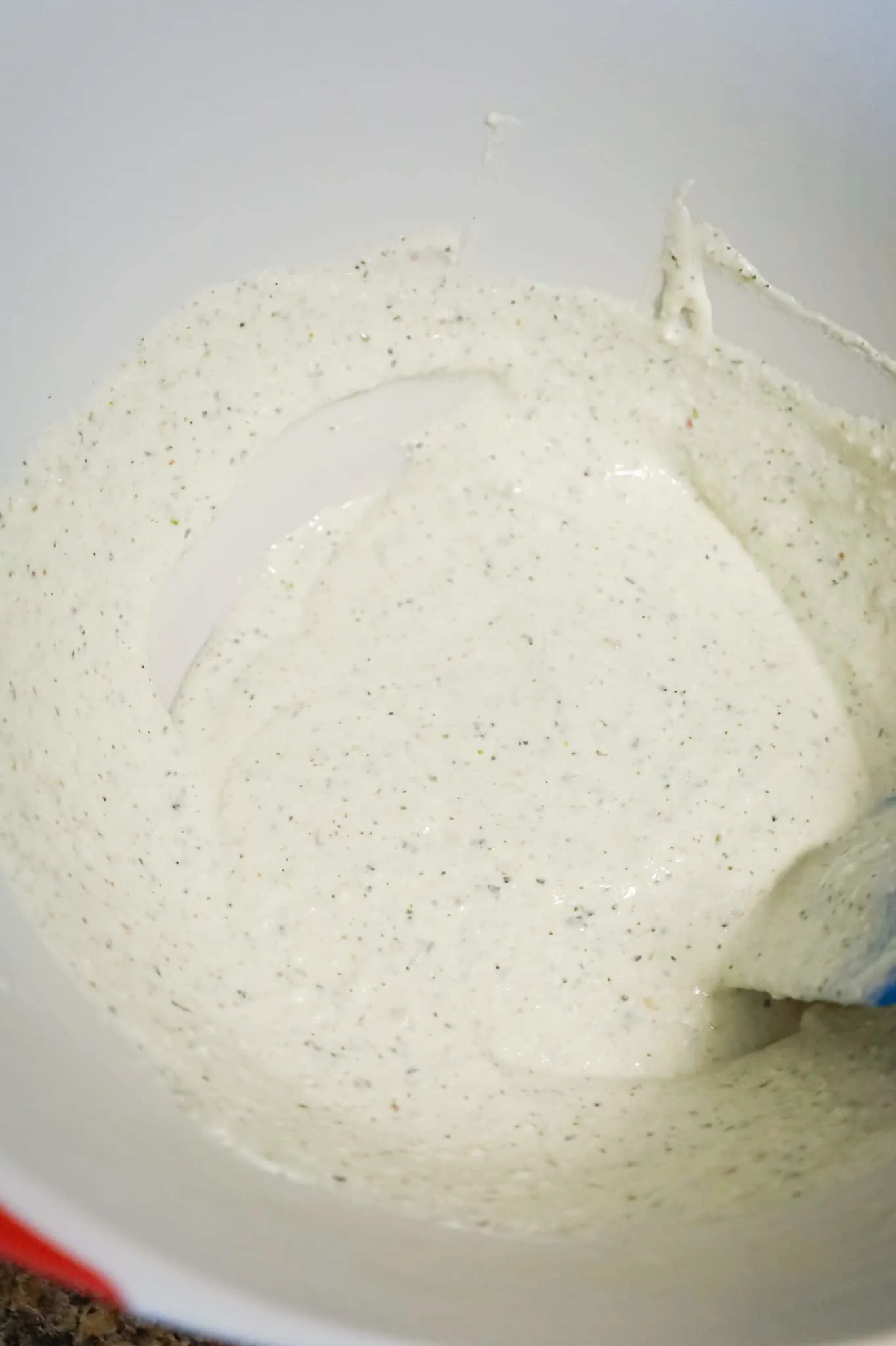 sour cream, ricotta and Italian seasoning mixture in a mixing bowl