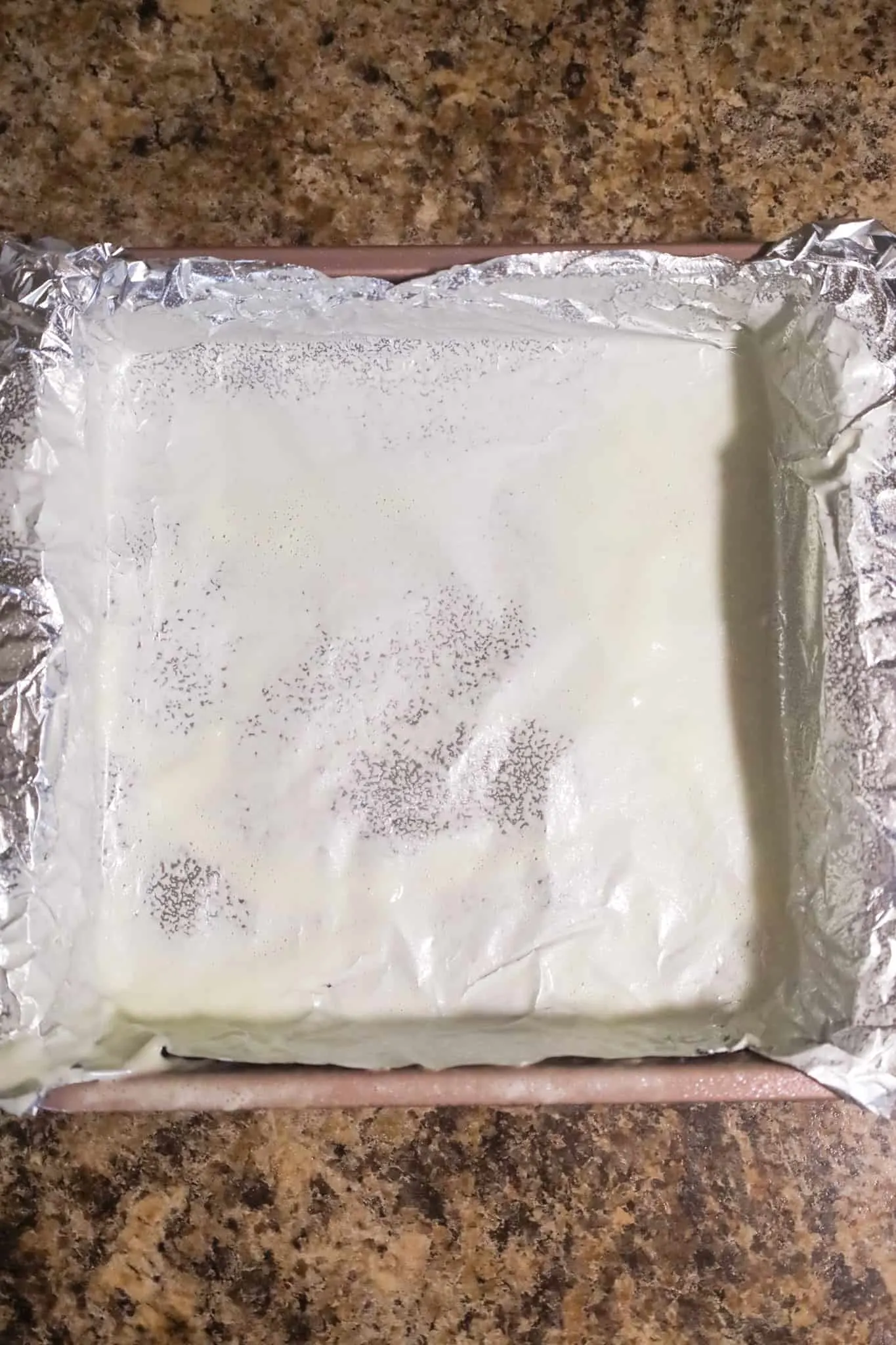 cooking spray coated foil in a baking pan