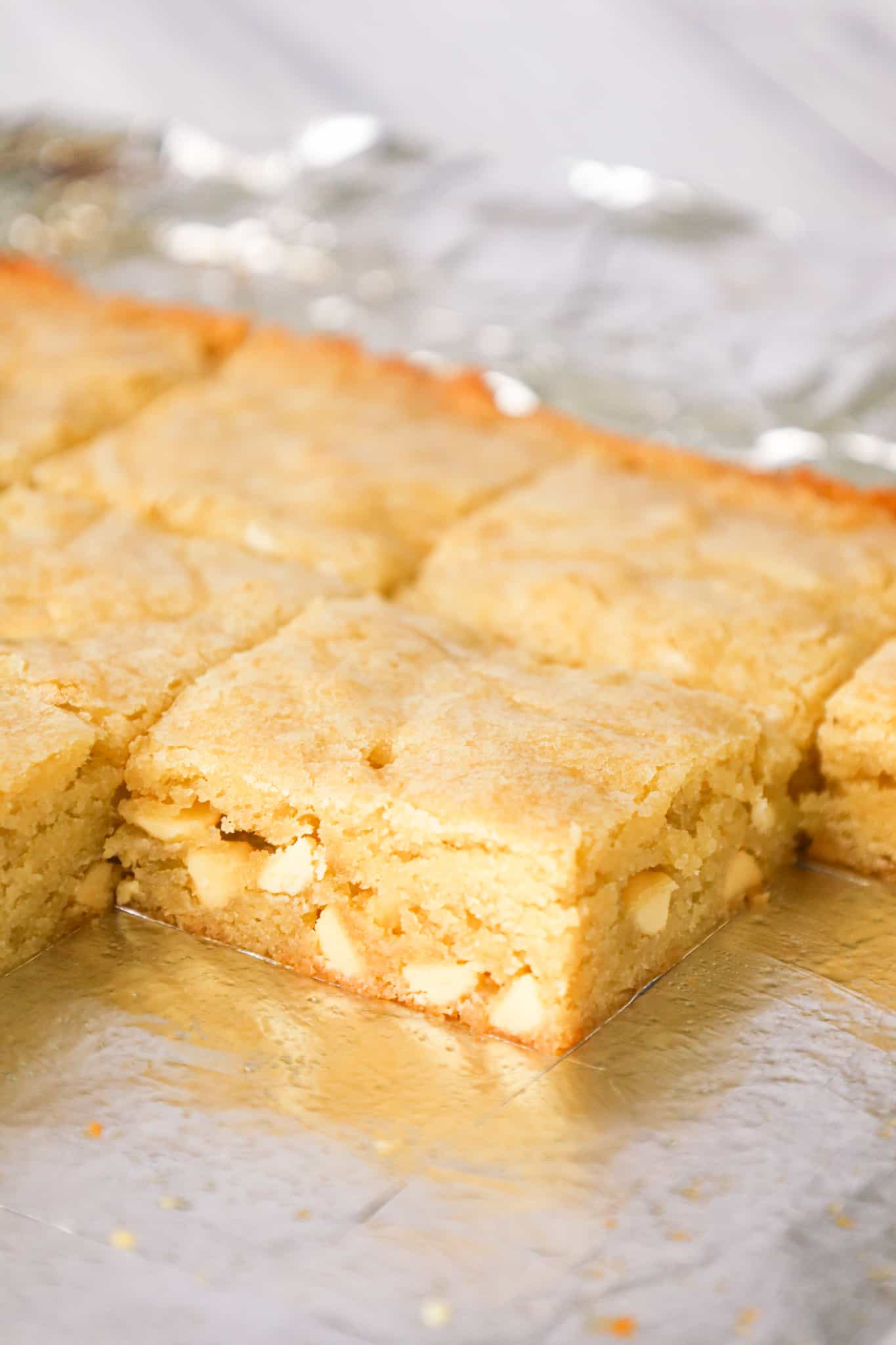 Vanilla Brownies are delicious chewy blonde brownies loaded with white chocolate chips.