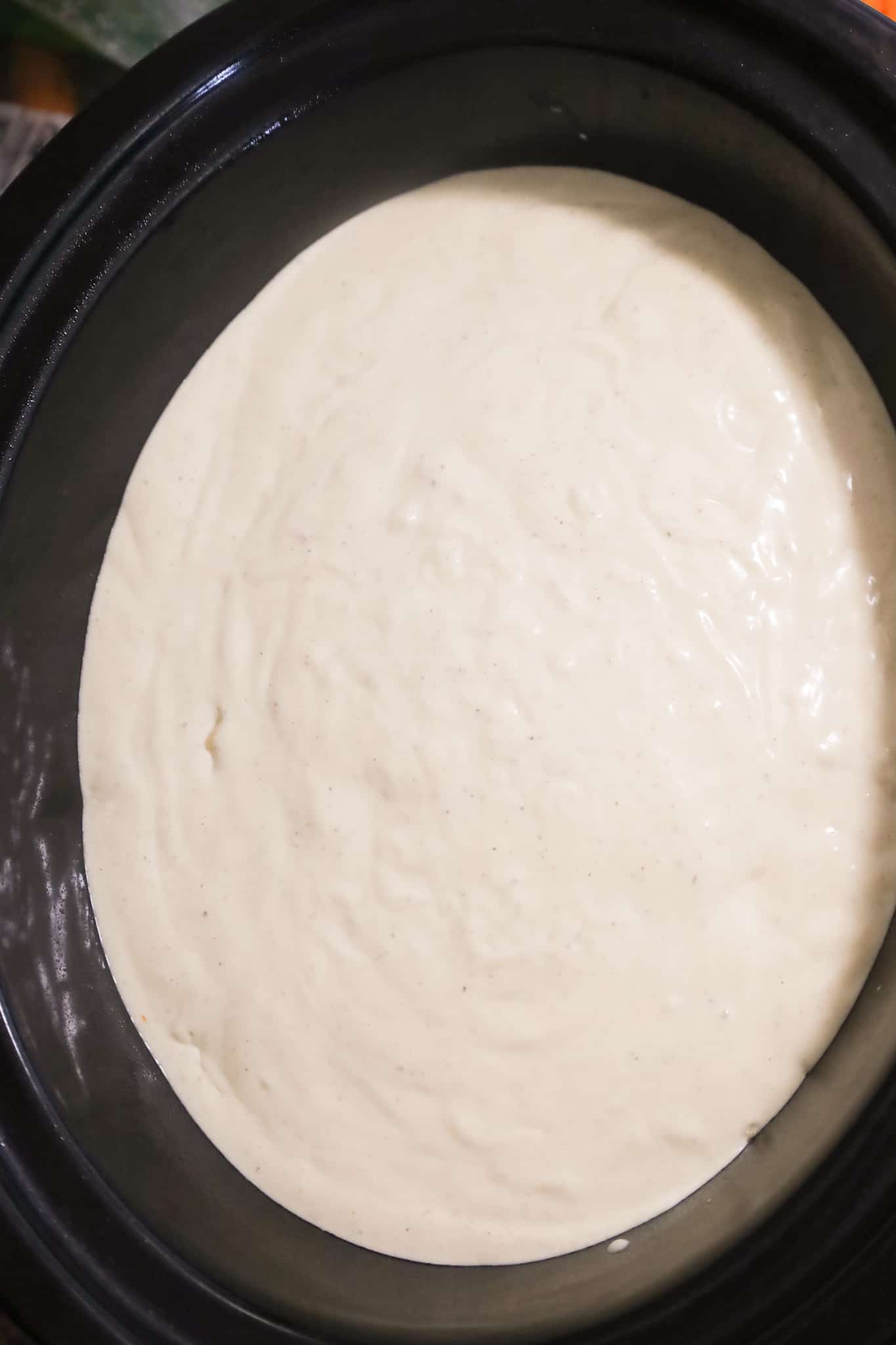 creamy chicken soup mixture in a crock pot