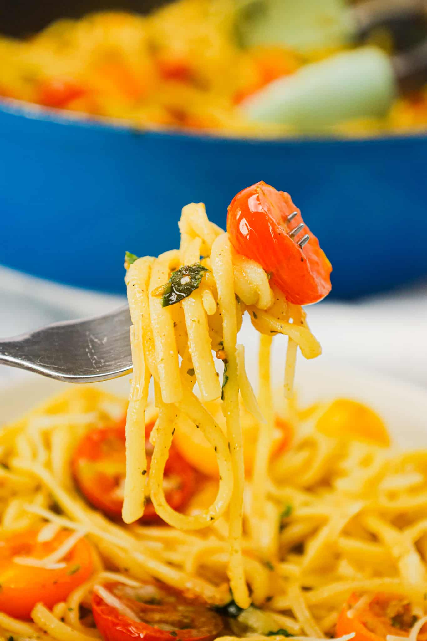 Linguine Positano is a delicious pasta dish loaded with fresh cherry tomatoes, onions, basil, parsley and garlic puree all tossed in olive oil.