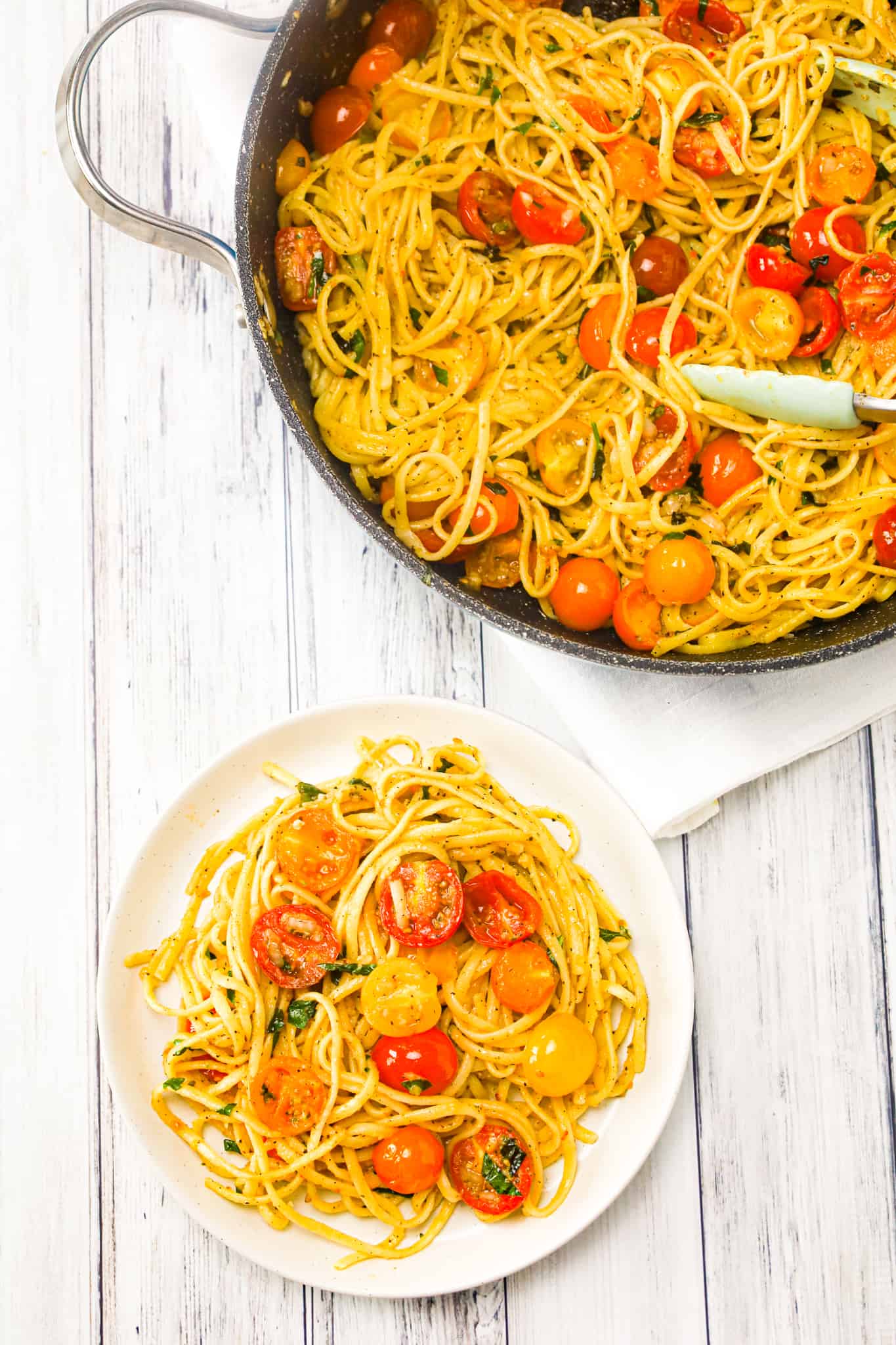 Linguine Positano is a delicious pasta dish loaded with fresh cherry tomatoes, onions, basil, parsley and garlic puree all tossed in olive oil.