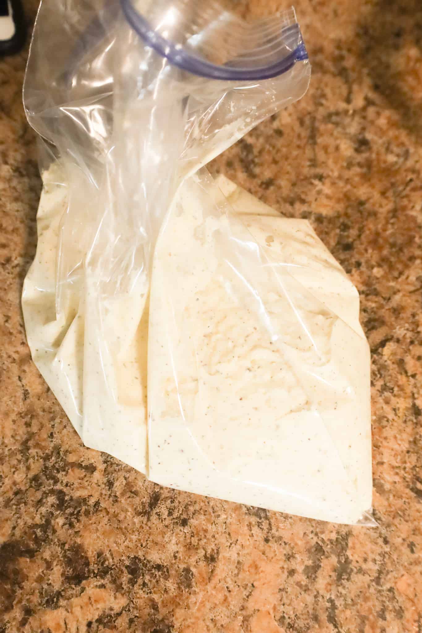 ricotta mixture in a large ziploc bag