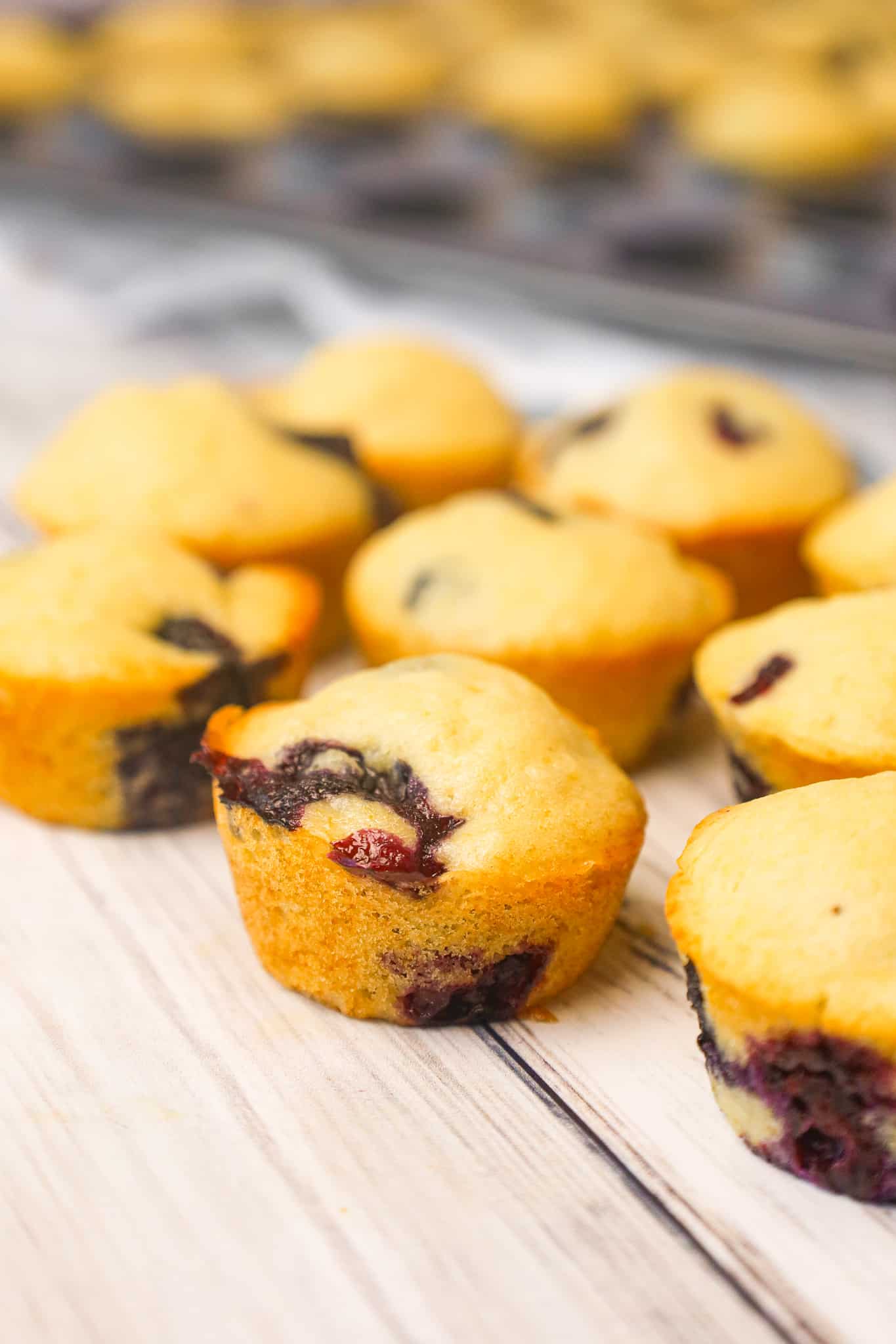 Mini Blueberry Muffins are tasty bite sized snacks loaded with fresh blueberries.