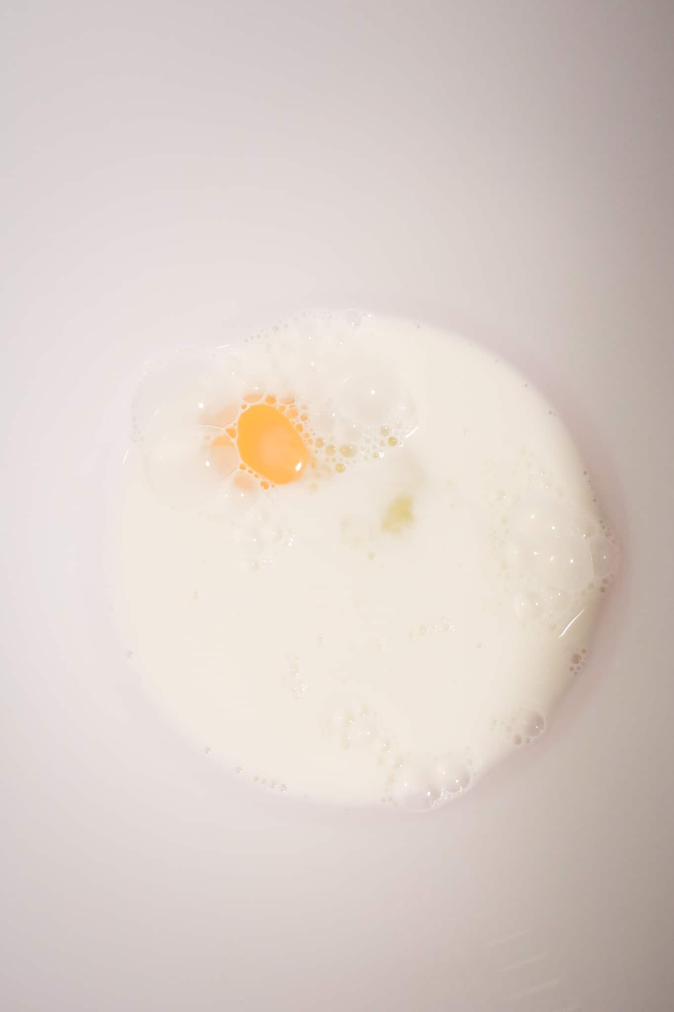 milk and egg in a mixing bowl