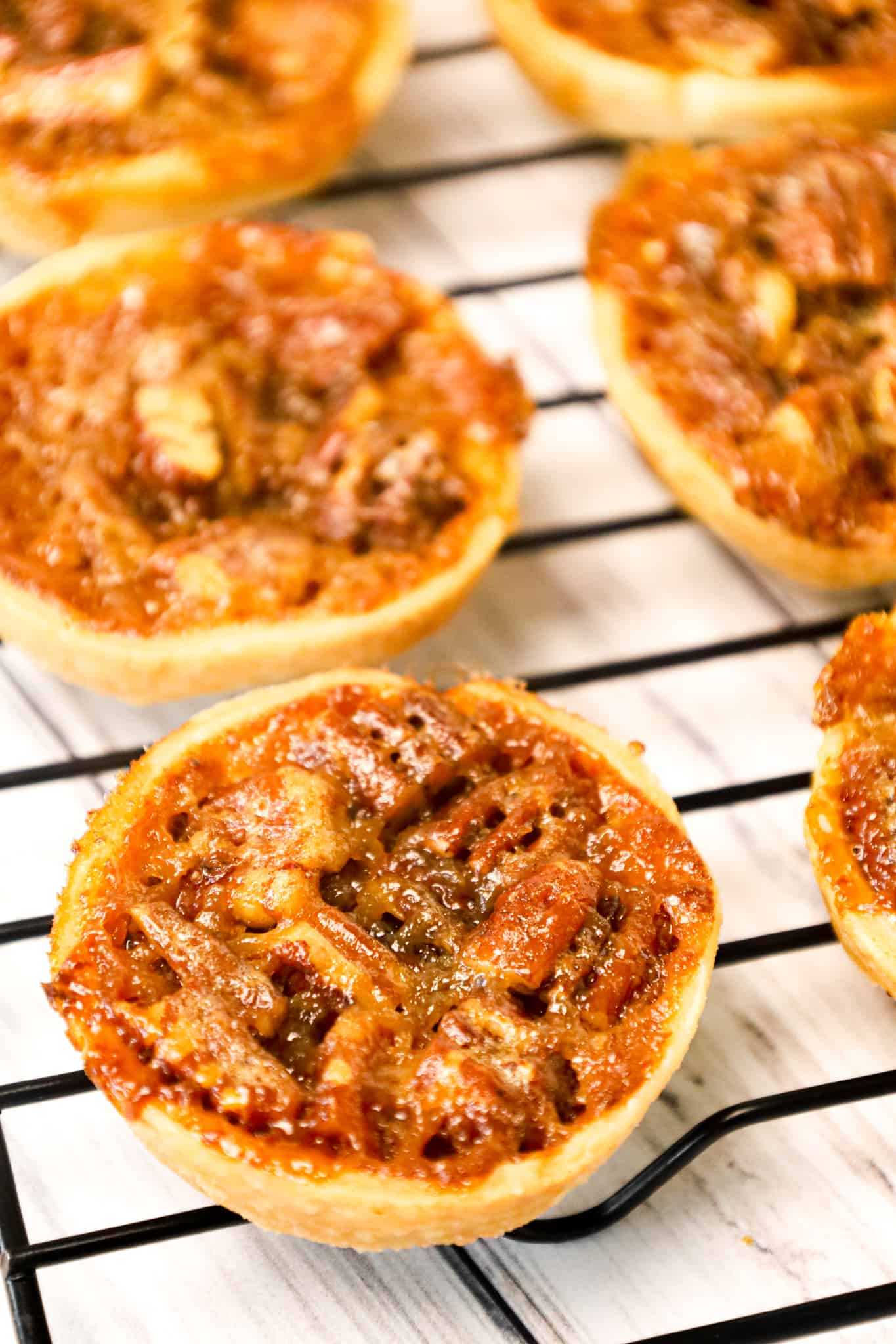 Pecan Tarts are delicious pastries with a sweet caramel and chopped pecan filling.