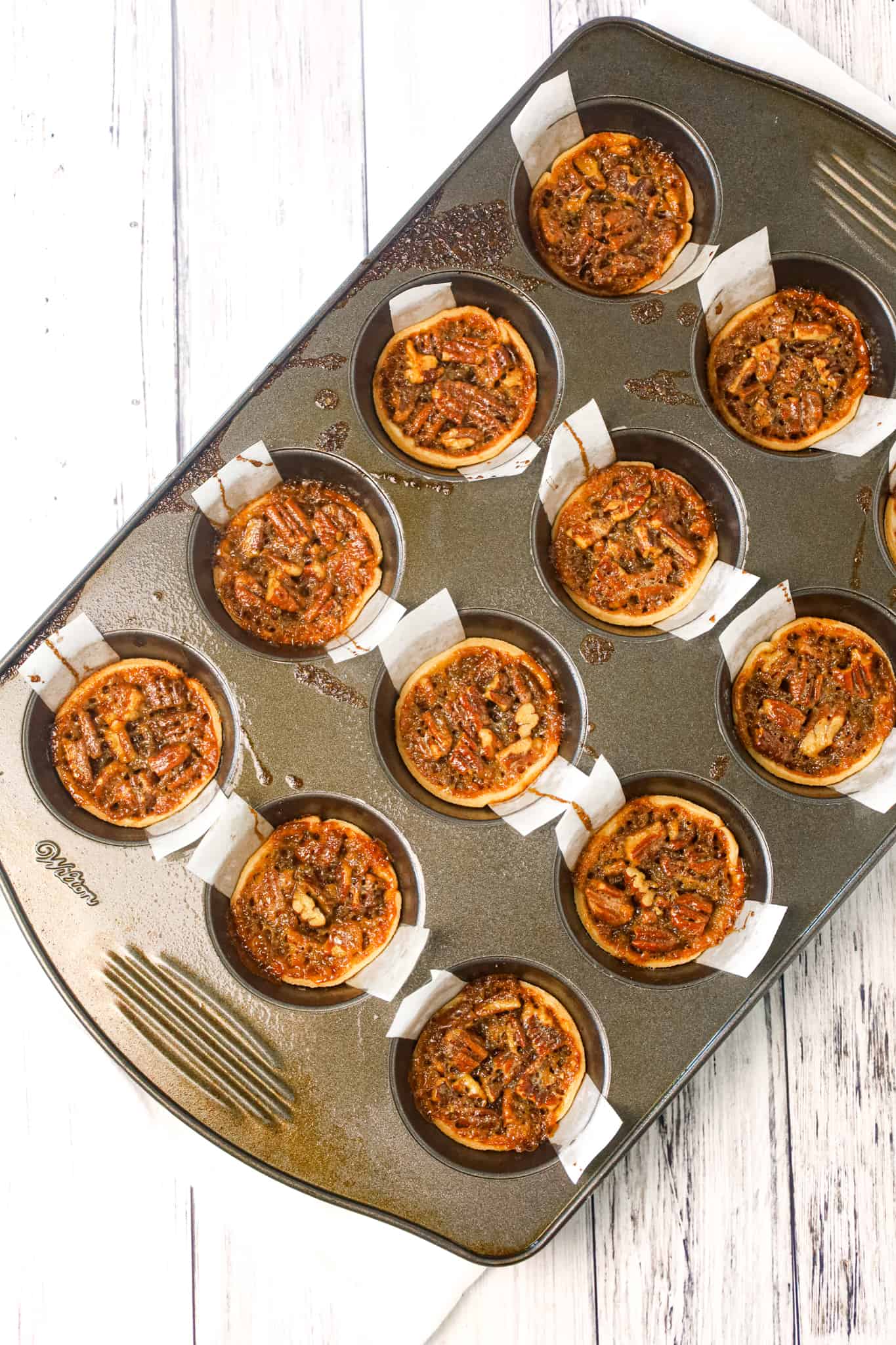 Pecan Tarts are delicious pastries with a sweet caramel and chopped pecan filling.