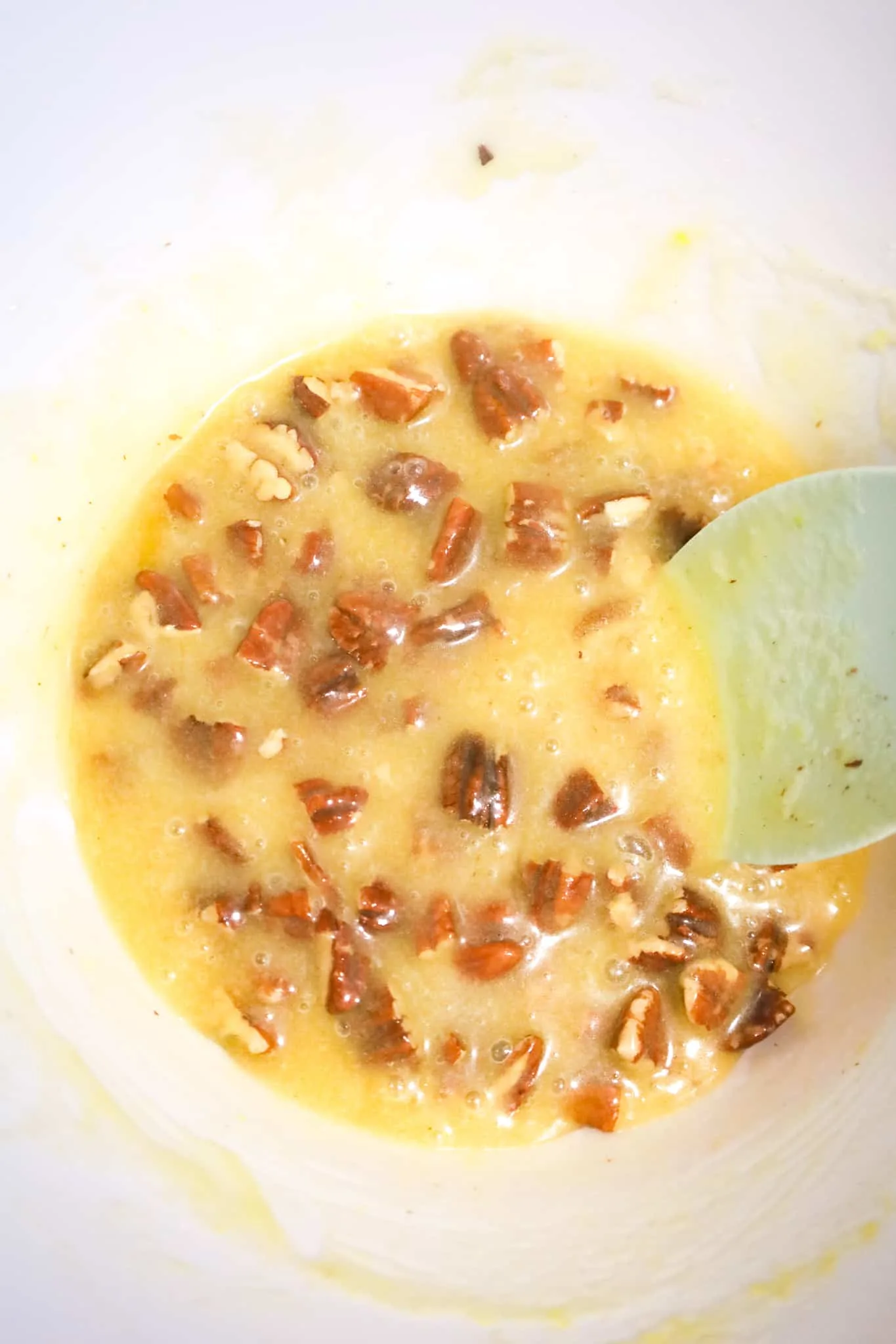 melted butter and sugar mixture with chopped pecans