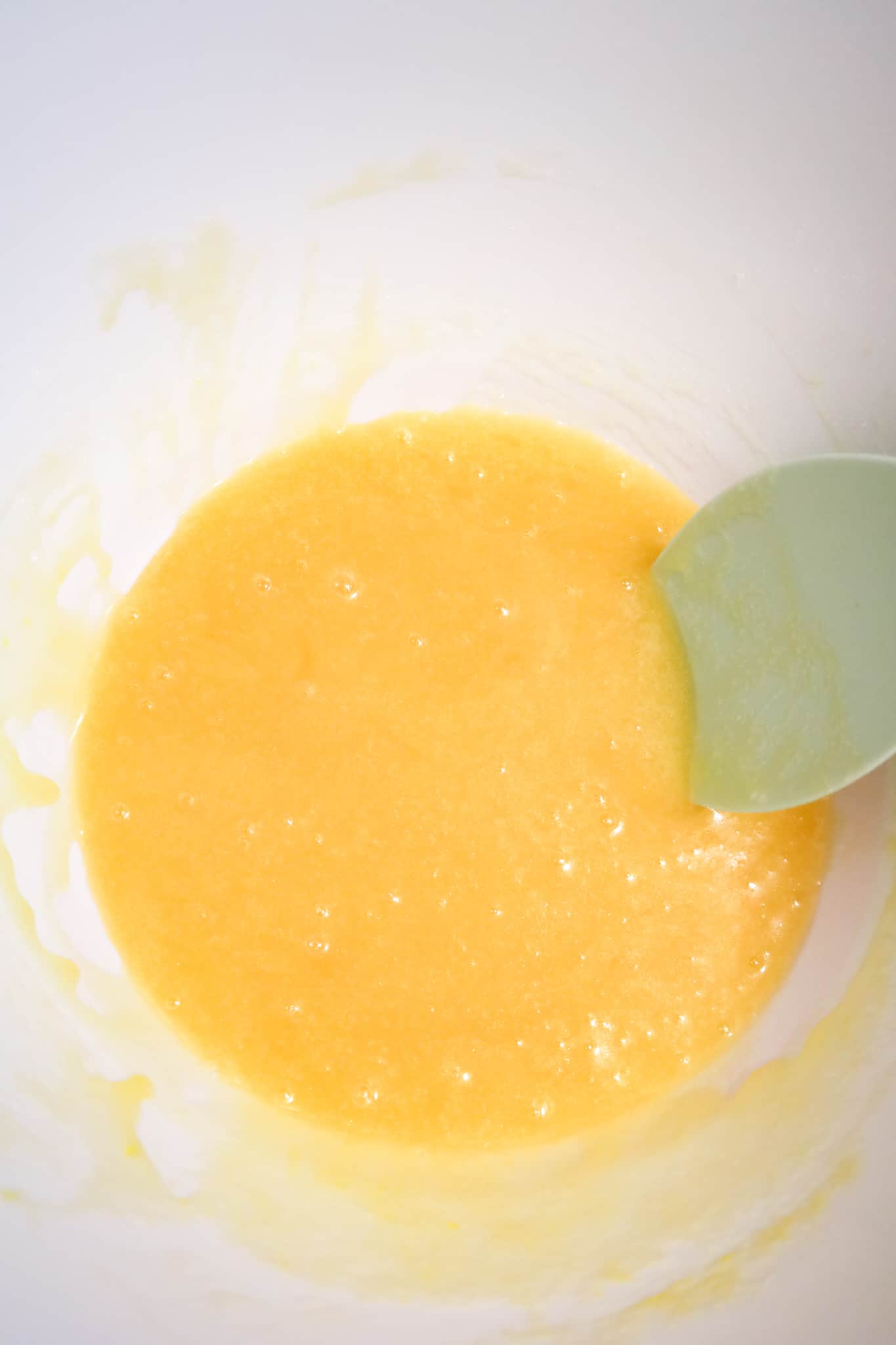 corn syrup, sugar, vanilla and melted butter mixture in a mixing bowl