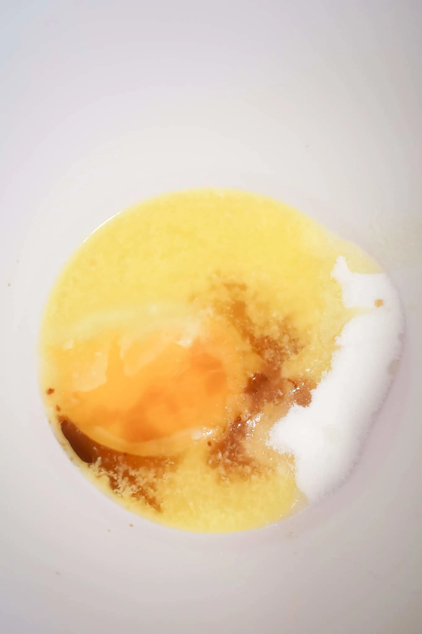 vanilla, egg, melted butter, sugar and corn syrup in a mixing bowl