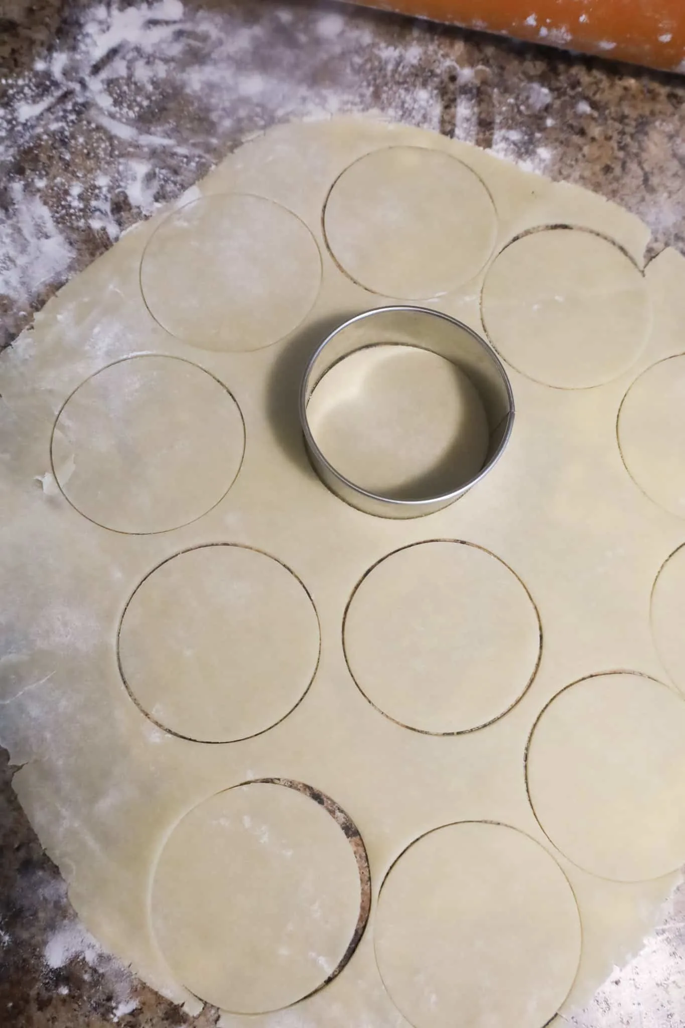 circle cookie cutter on pastry on counter