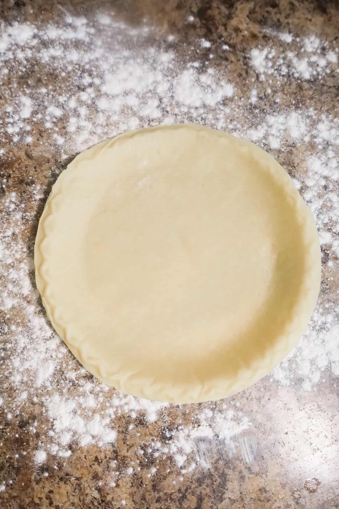 pie shell on floured counter