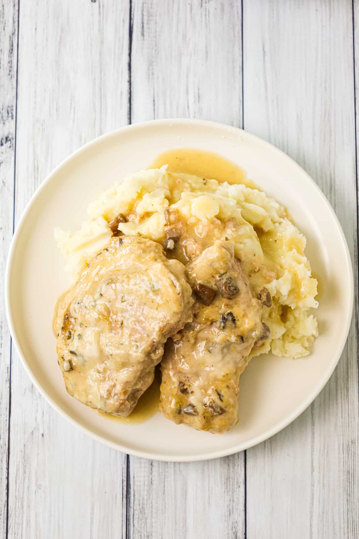  3 Ingredient Crock Pot Pork Chops are an easy slow cooker dinner recipe made with condensed cream of mushroom soup and ranch dressing mix.