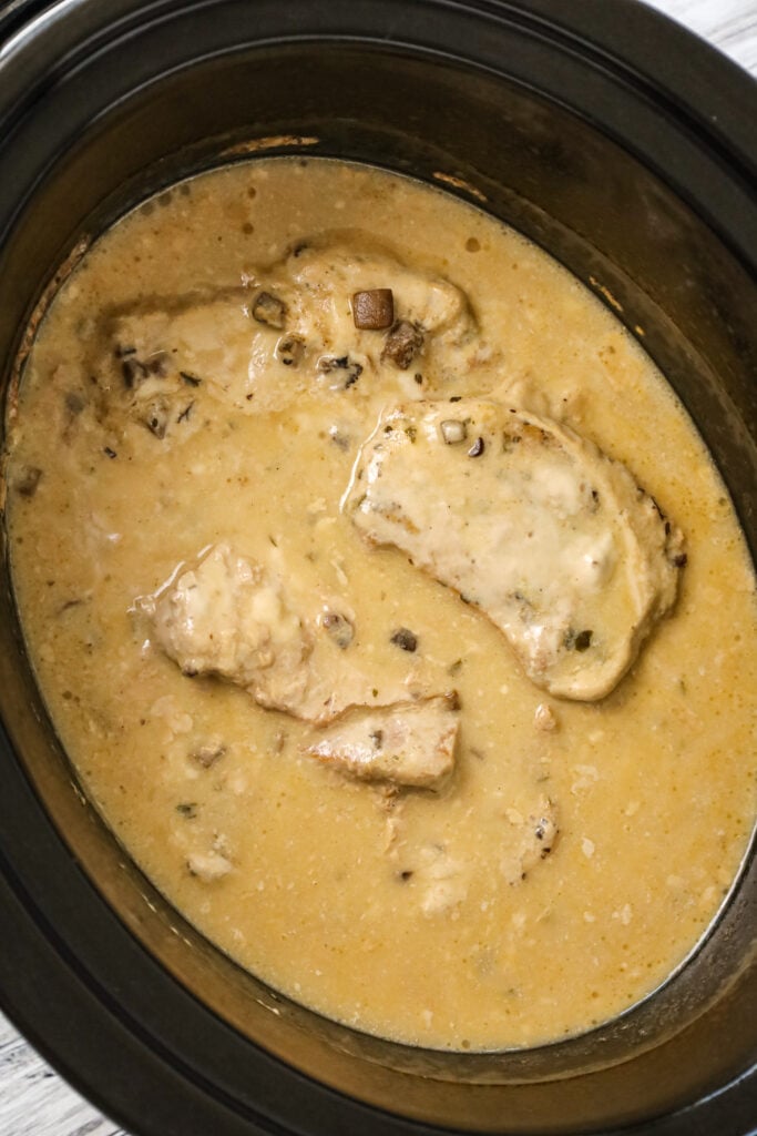  3 Ingredient Crock Pot Pork Chops are an easy slow cooker dinner recipe made with condensed cream of mushroom soup and ranch dressing mix.