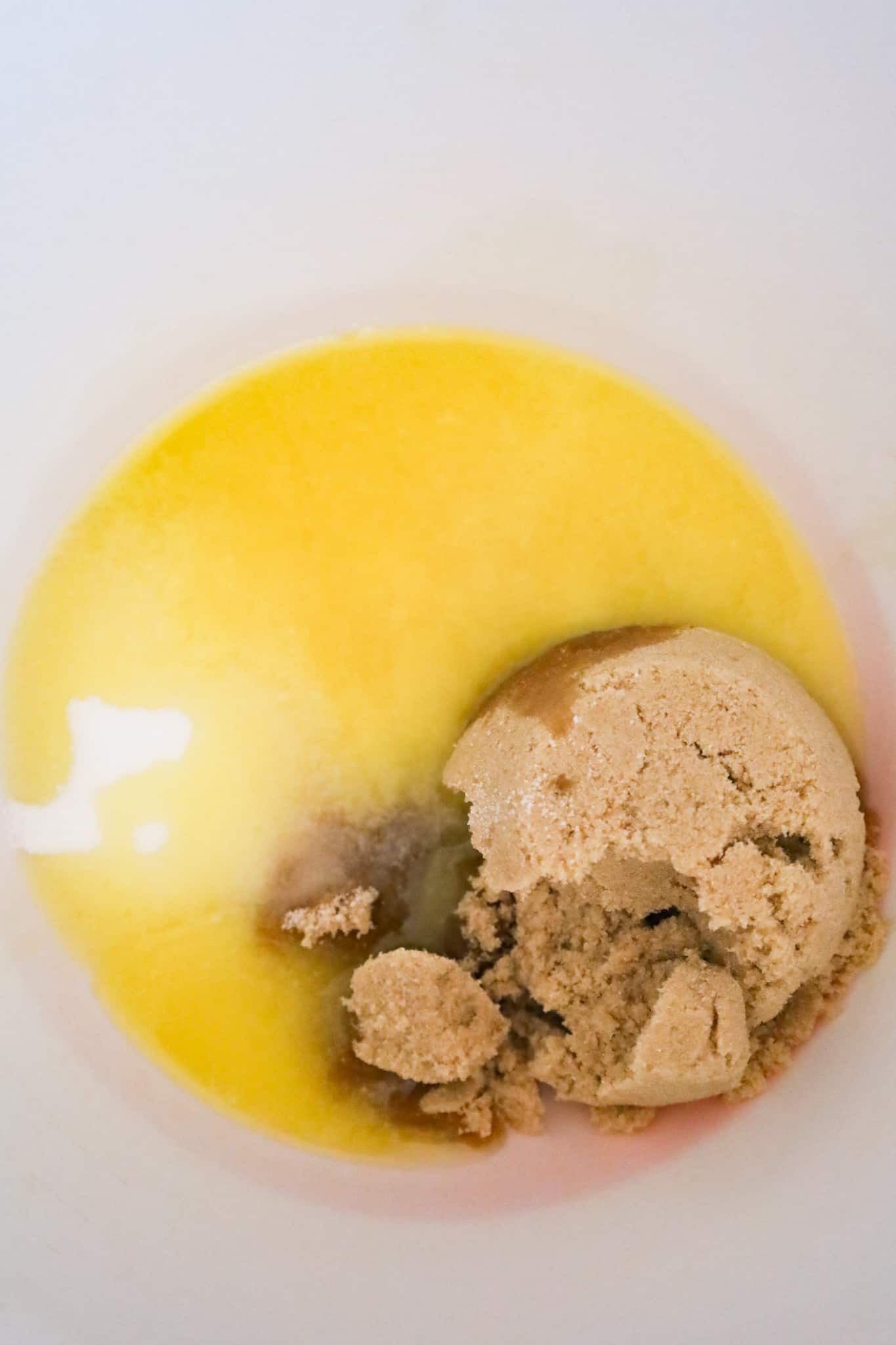 granulated sugar, brown sugar and melted butter in a mixing bowl