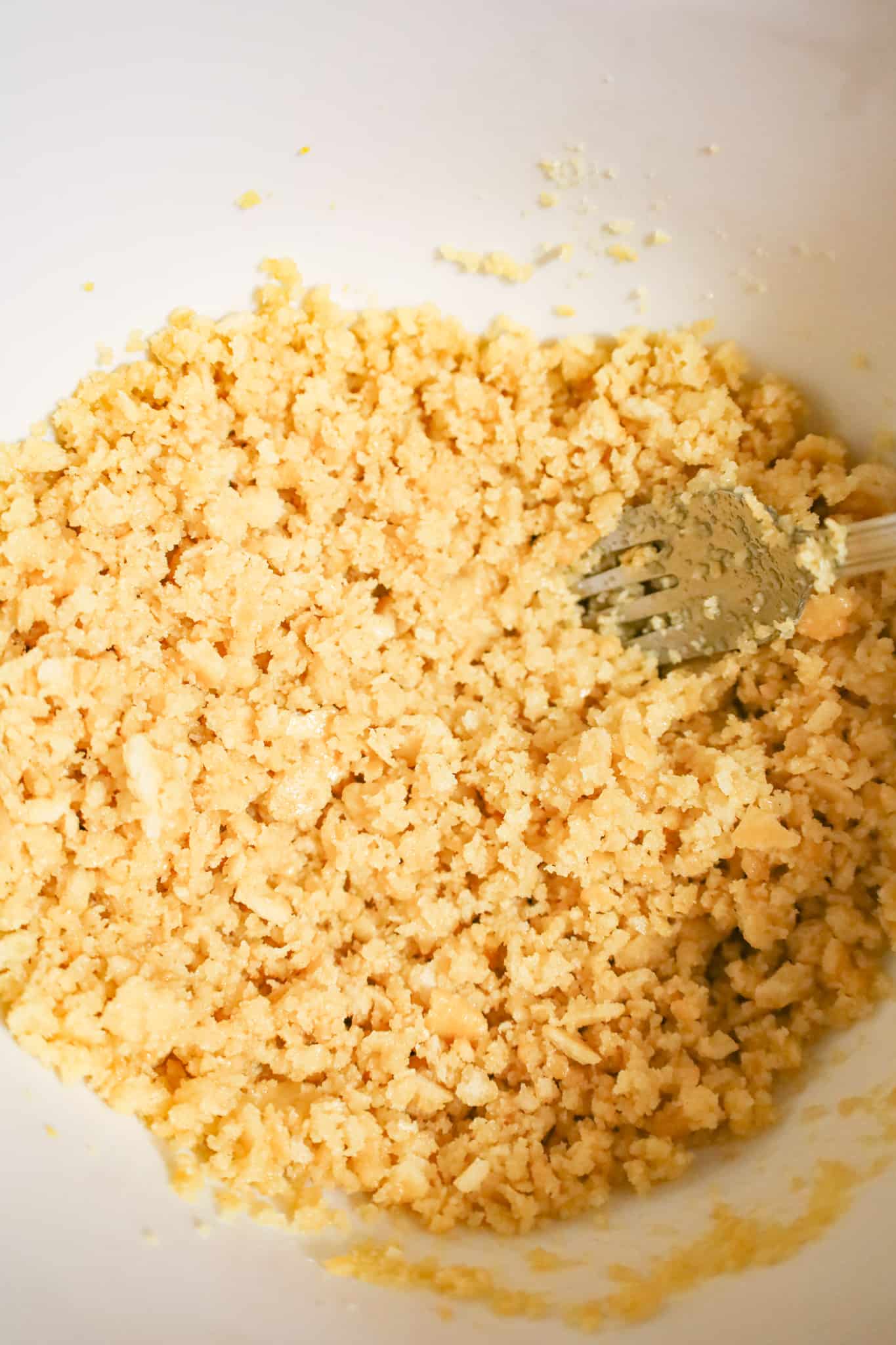 ritz cracker crumb and butter mixture in a mixing bowl