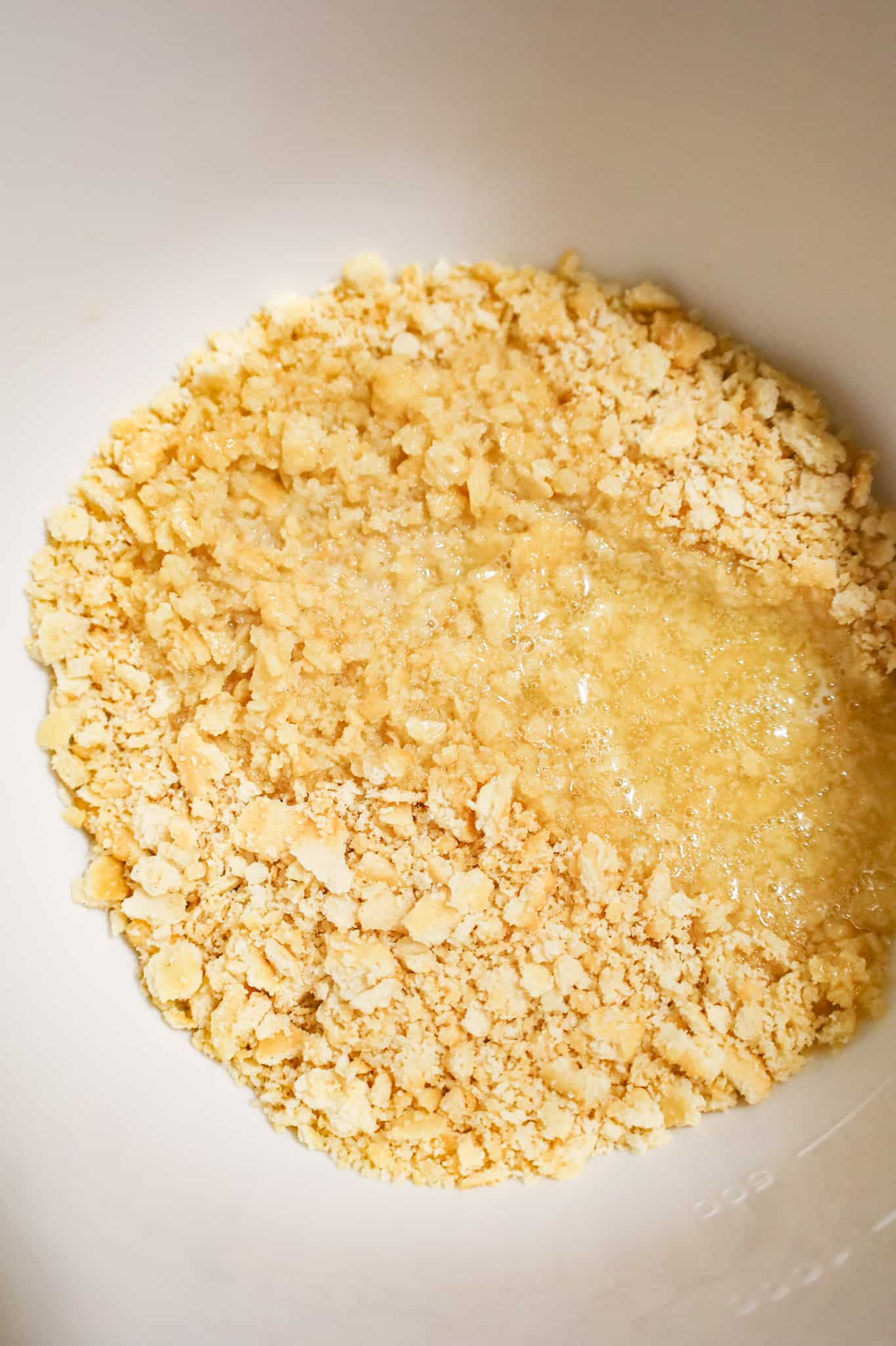 melted butter and Ritz cracker crumbs in a mixing bowl