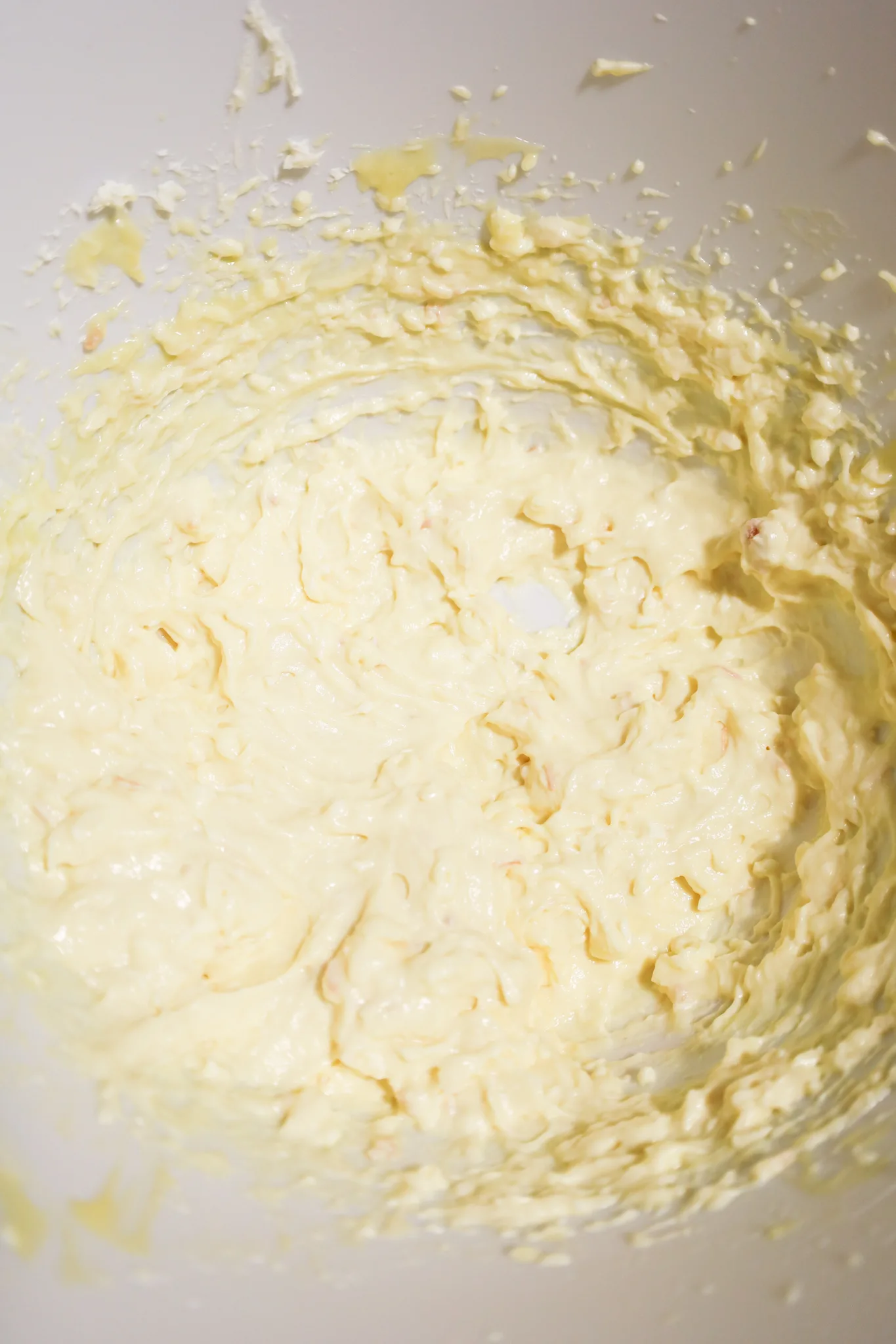 cream cheese and cream of chicken soup mixture in a mixing bowl