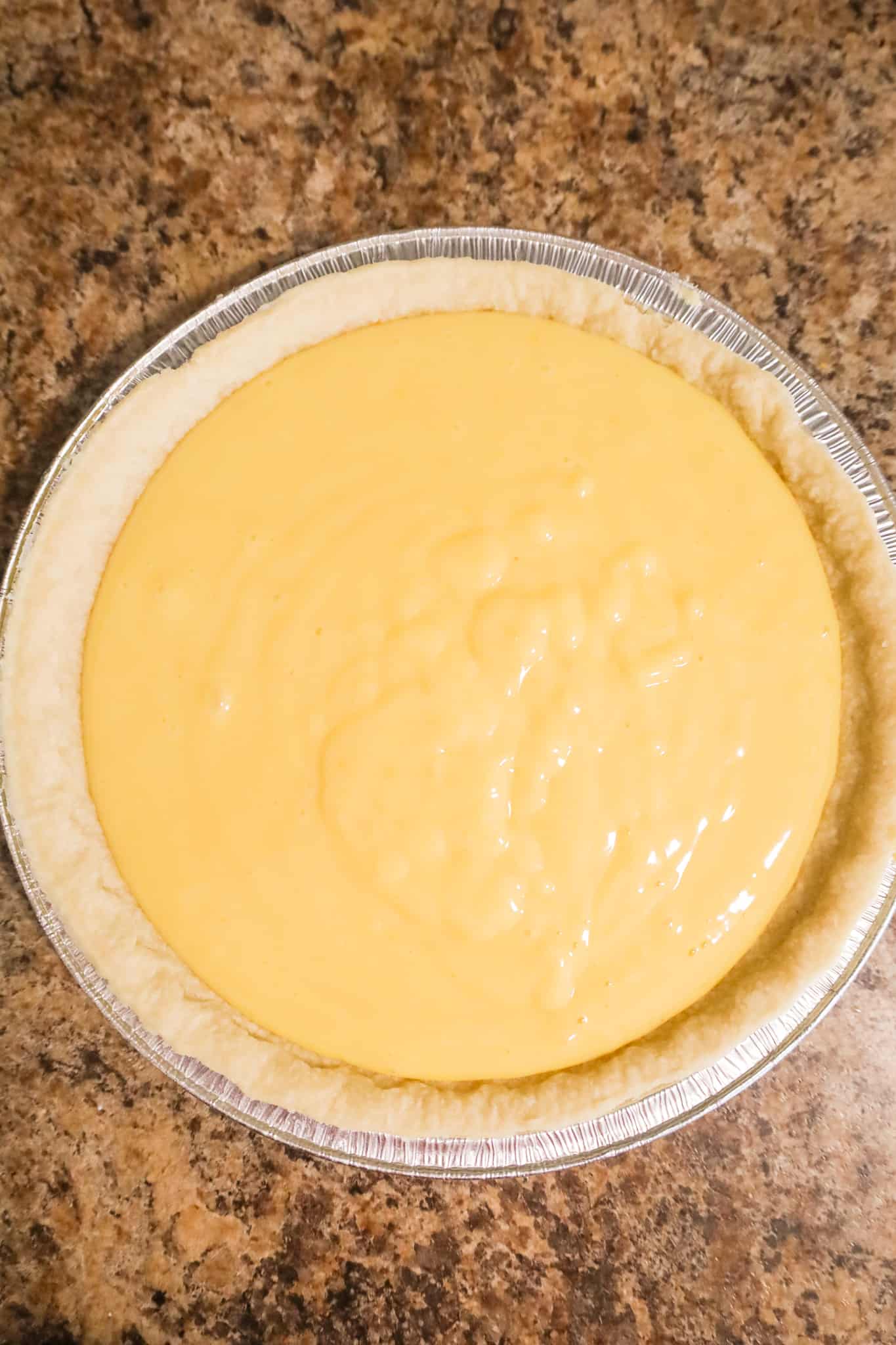 orange pie filling in a crust before baking