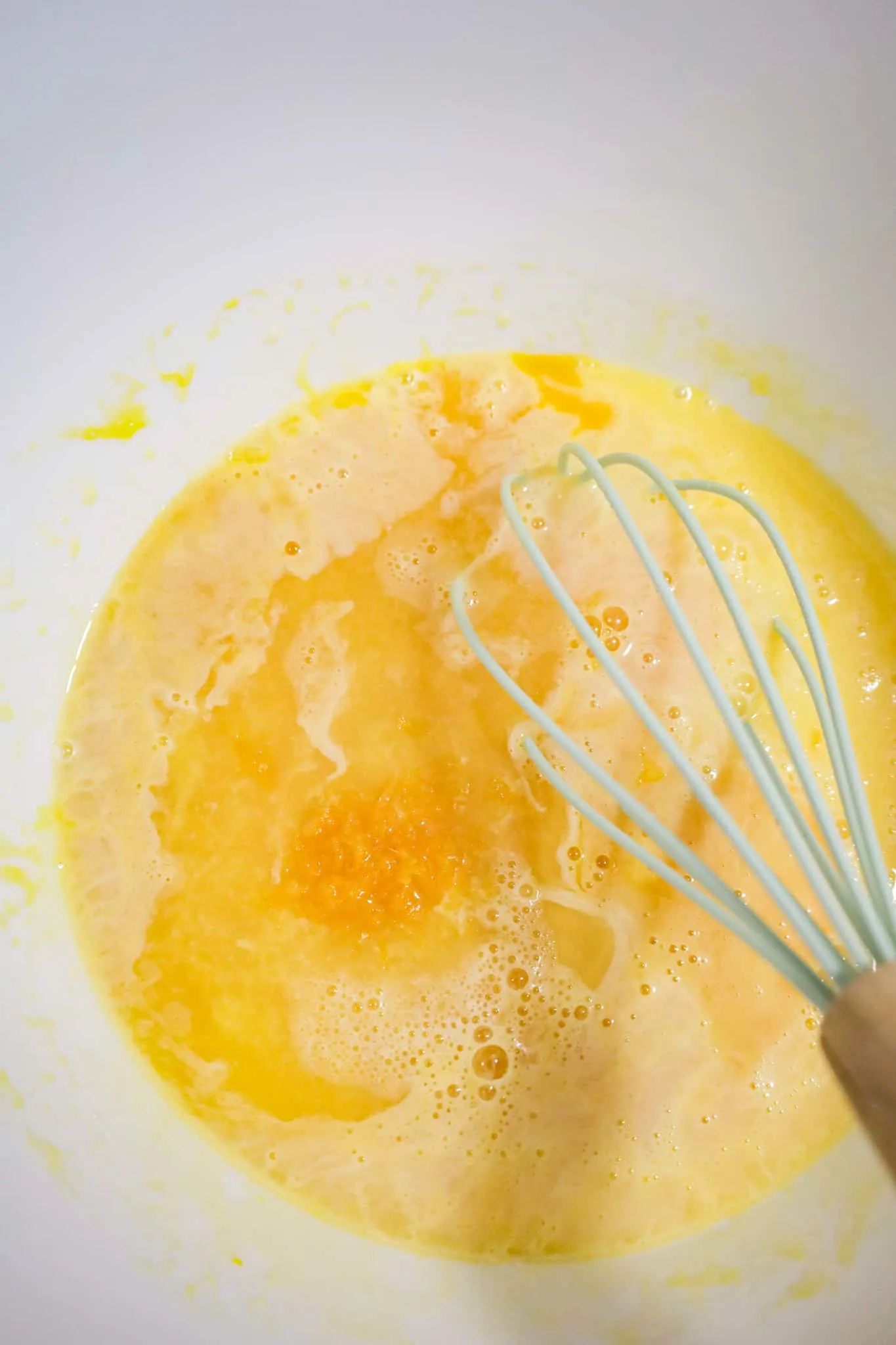 orange juice concentrate, orange zest, lime juice, egg yolks and sweetened condensed milk in a mixing bowl