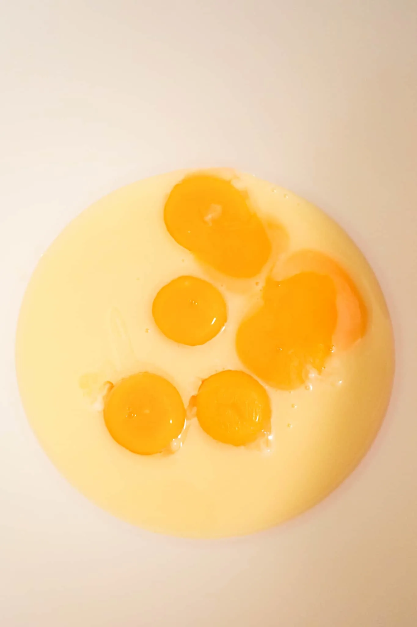 egg yolks and sweetened condensed milk in a mixing bowl