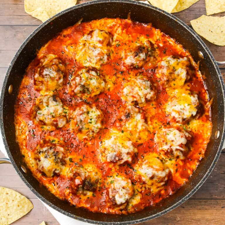 Tex Mex Meatballs are an easy dinner recipe made with ground beef, crushed corn chips, taco seasoning and cheese cooked in a sauce made with tomato sauce and salsa.