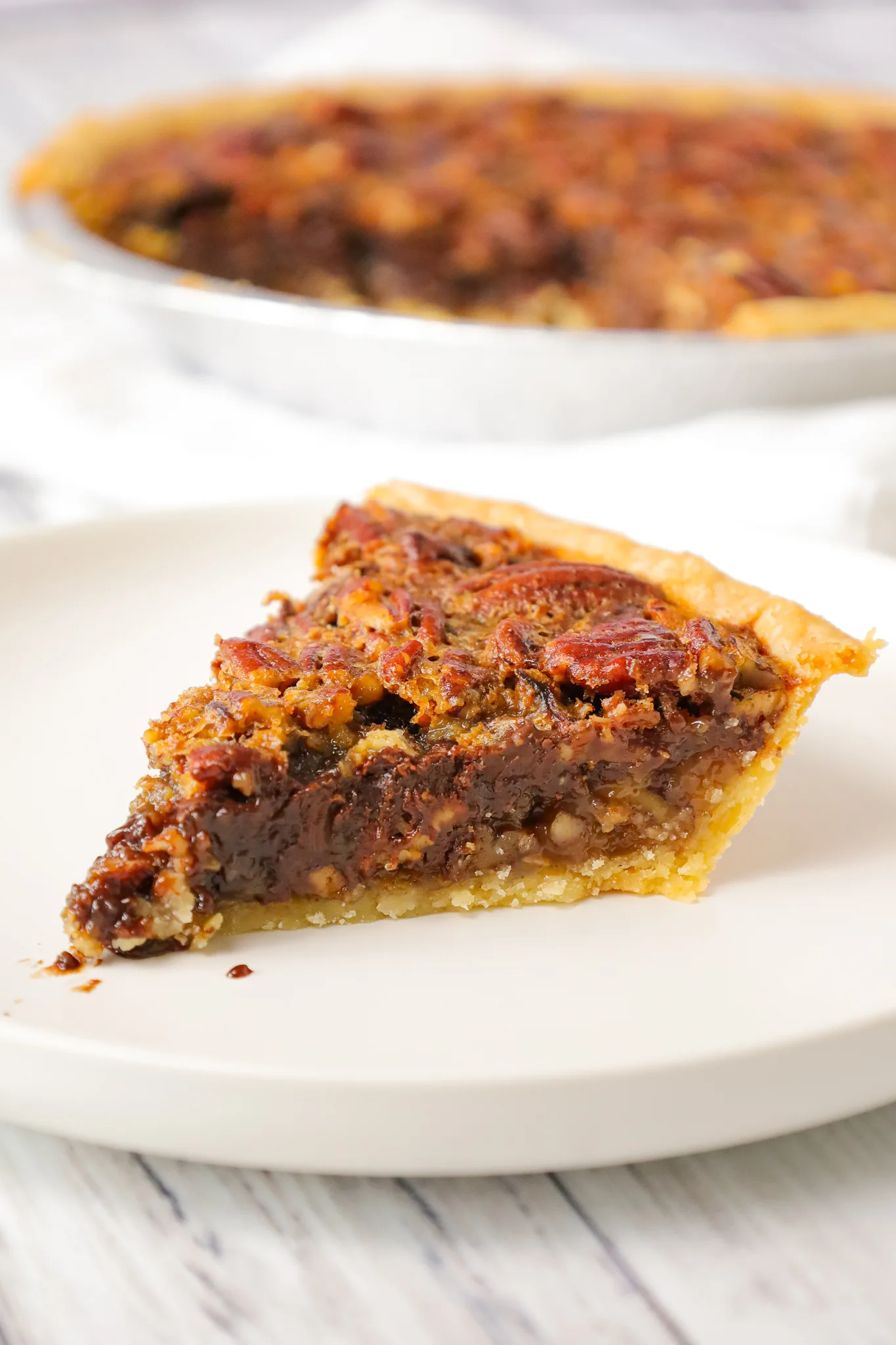 Chocolate Chip Pecan Pie is a decadent chocolate and caramel pie loaded with pecans.
