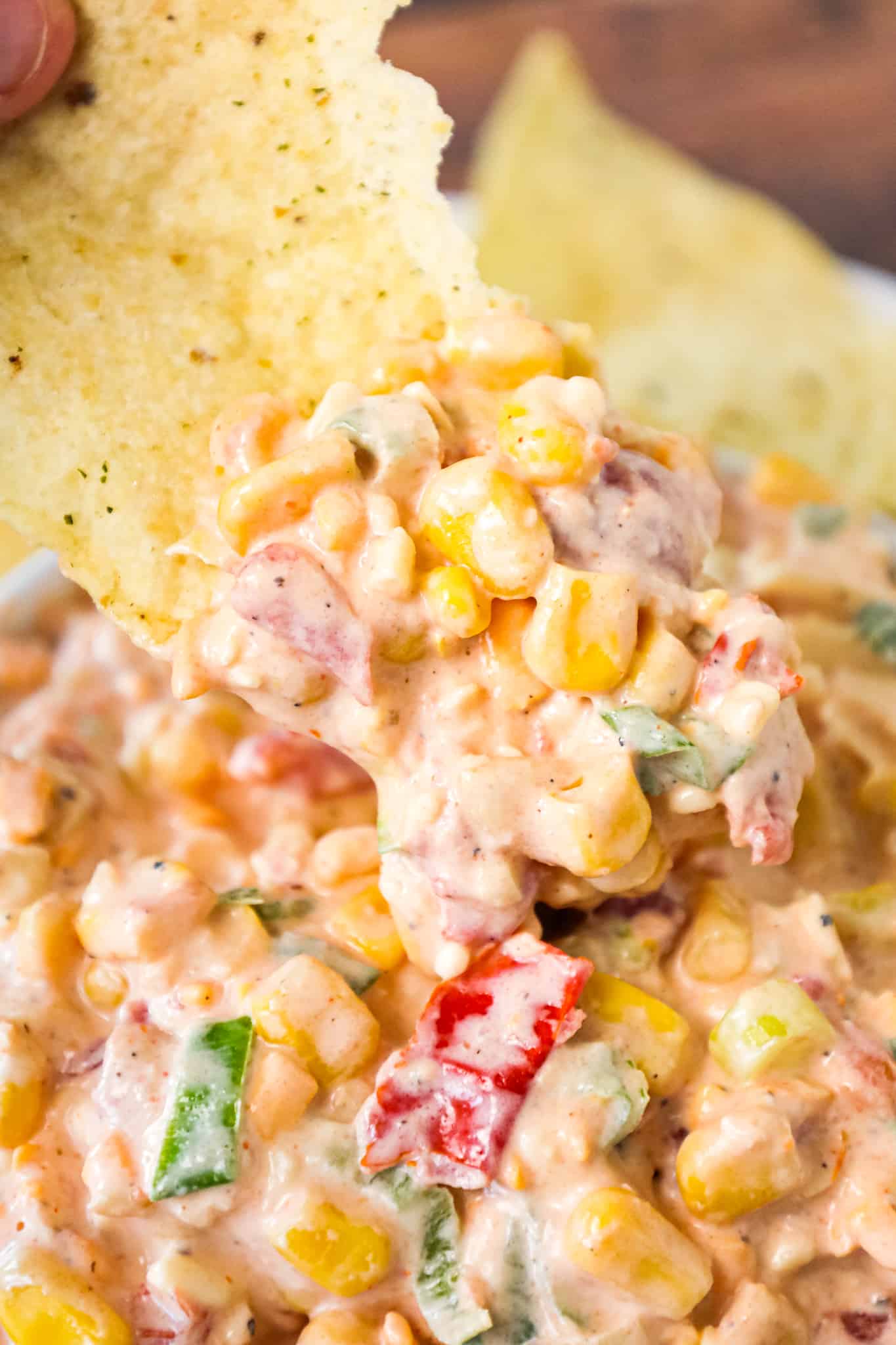 Corn Dip with Cream Cheese is a tasty cold dip recipe made with canned corn, cream cheese, sour cream, Rotel, shredded cheese and chopped green onions.