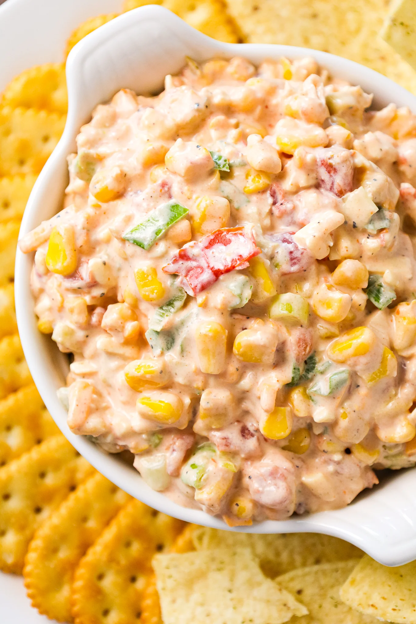 Corn Dip with Cream Cheese is a tasty cold dip recipe made with canned corn, cream cheese, sour cream, Rotel, shredded cheese and chopped green onions.