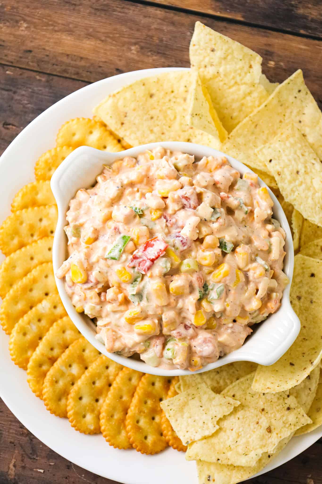 Corn Dip with Cream Cheese is a tasty cold dip recipe made with canned corn, cream cheese, sour cream, Rotel, shredded cheese and chopped green onions.