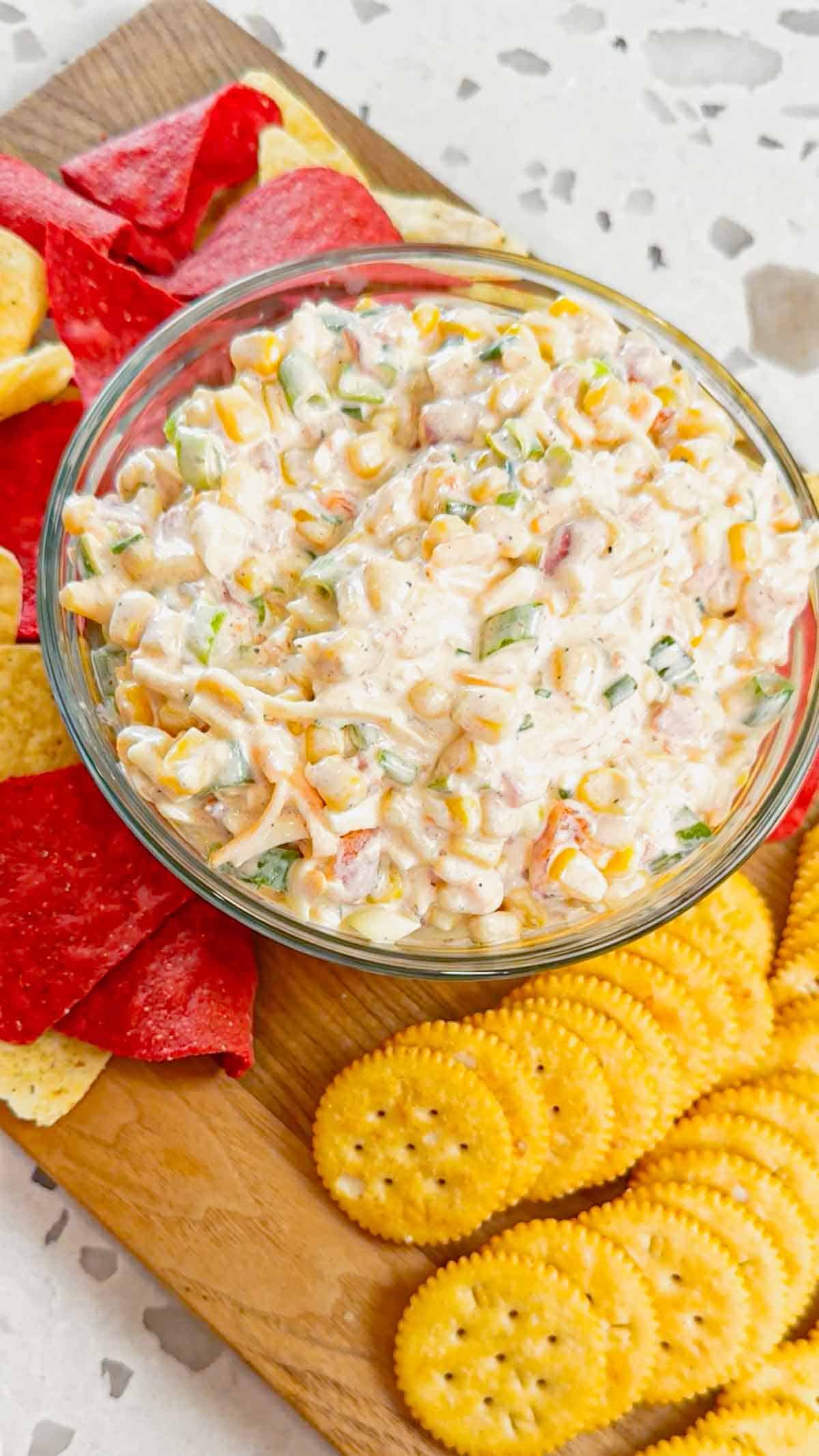 Corn Dip with Cream Cheese is a tasty cold dip recipe made with canned corn, cream cheese, sour cream, Rotel, shredded cheese and chopped green onions.