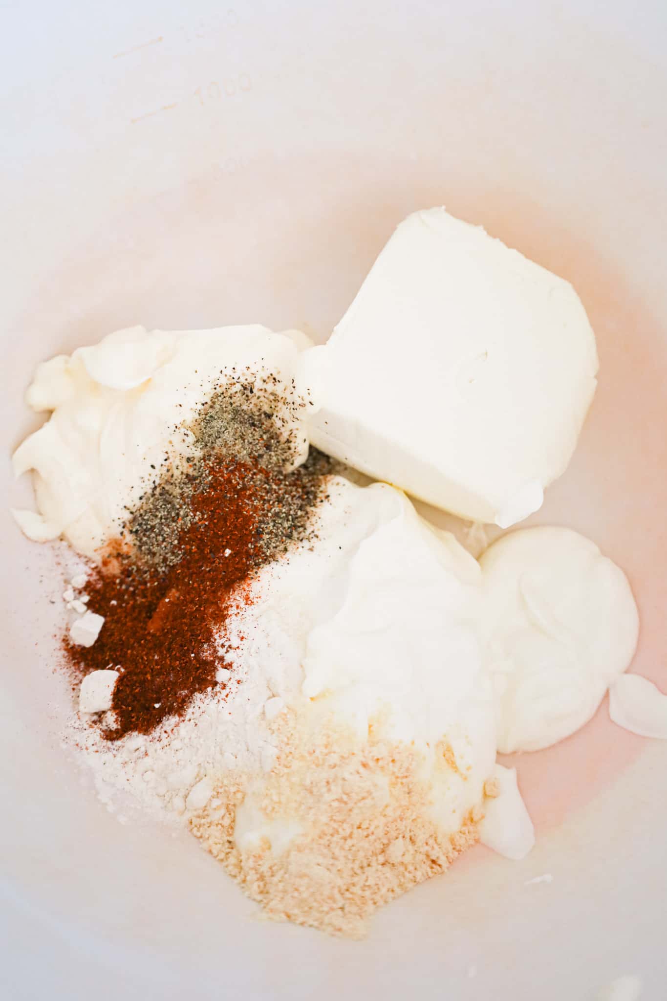 cream cheese, sour cream, mayo and spices in a mixin gbowl