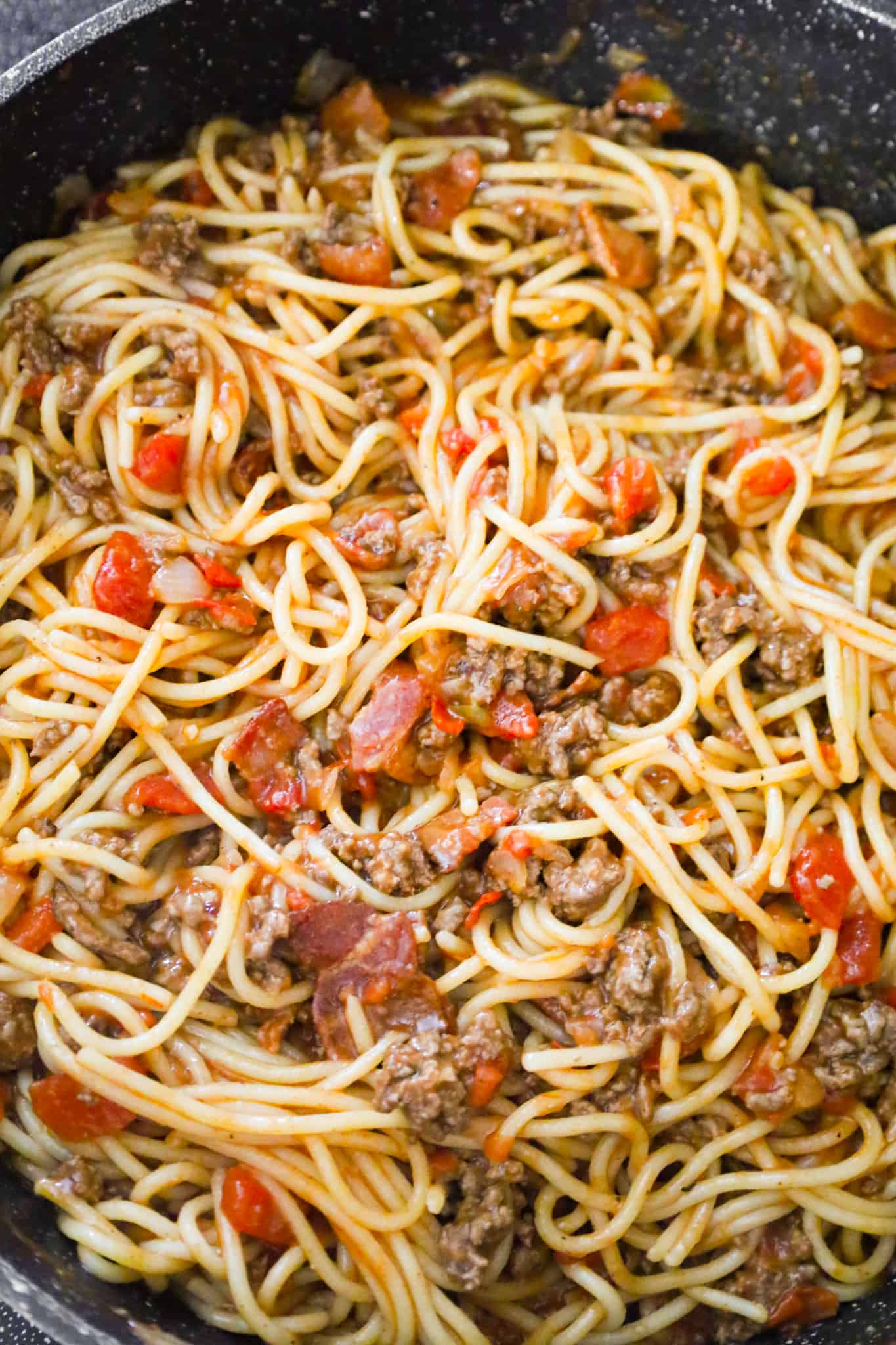 spaghetti and ground beef mixture in a skillet