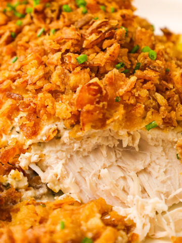 Crispy Sour Cream and Onion Chicken is an easy dinner recipe with boneless skinless chicken breasts baked in a sour cream mixture and topped with crushed French's fried onions.