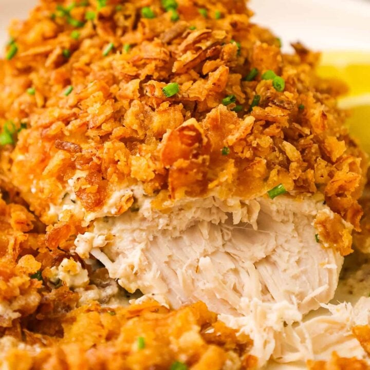 Crispy Sour Cream and Onion Chicken is an easy dinner recipe with boneless skinless chicken breasts baked in a sour cream mixture and topped with crushed French's fried onions.