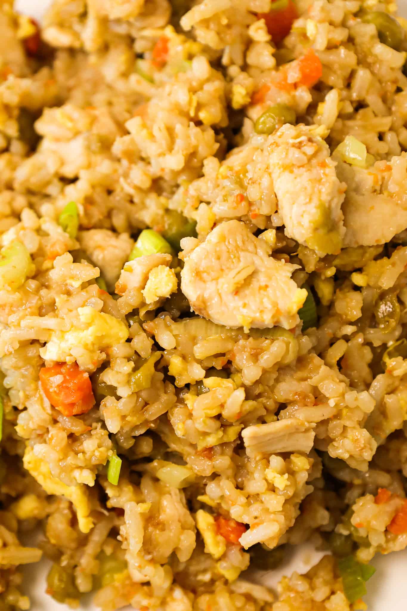 Instant Pot Chicken Fried Rice is an easy pressure cooker dinner recipe made with long grain white rice, boneless skinless chicken breasts, scrambled eggs and peas and carrots all seasoned with chicken broth, soy sauce and toasted sesame oil.