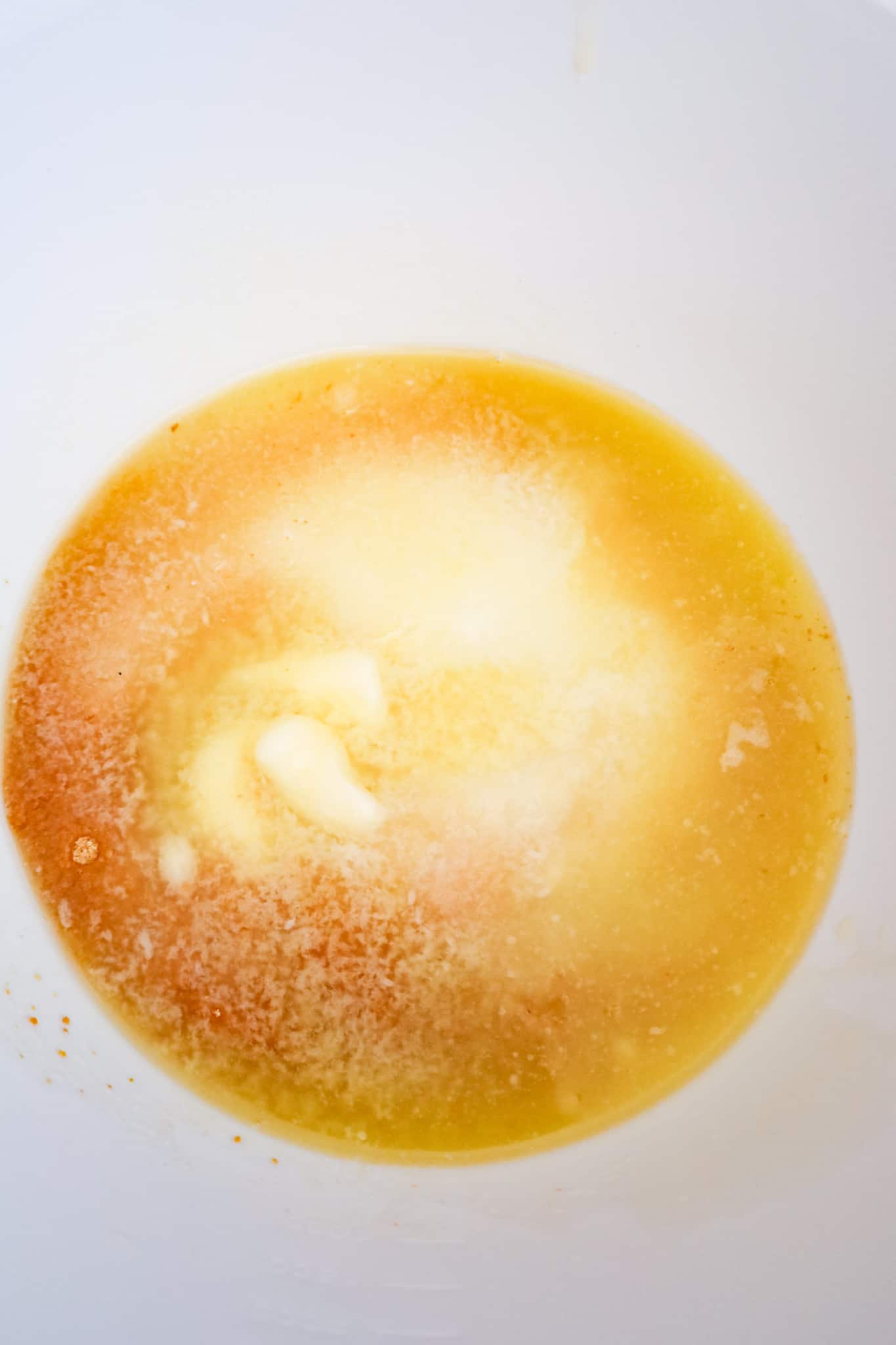 melted butter, sugar and graham crumbs in a mixing bowl