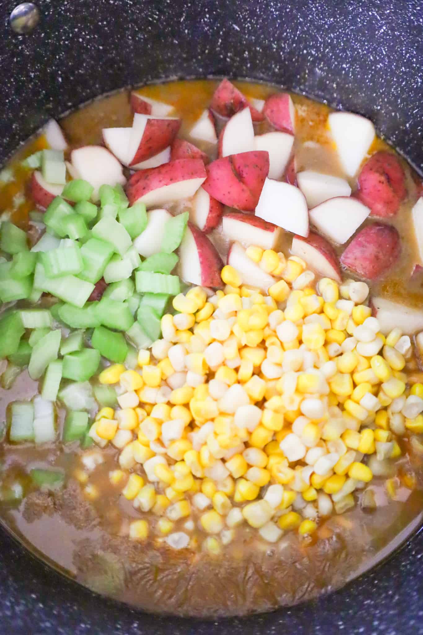 red potato chunks, chopped celery and corn added to steak soup
