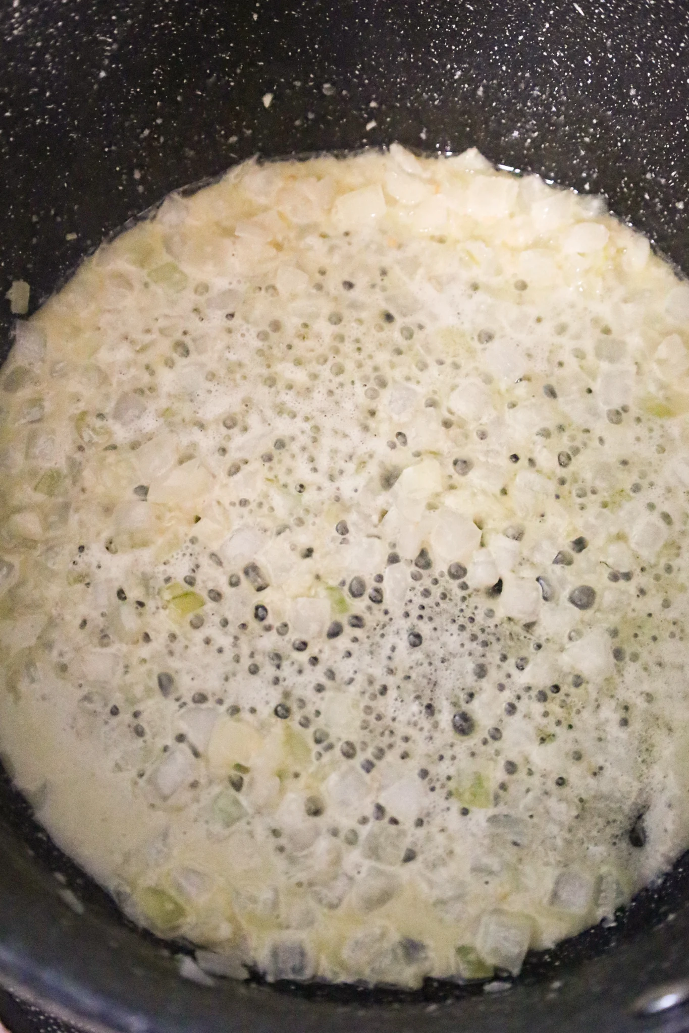 melted butter and diced onions in a large pot