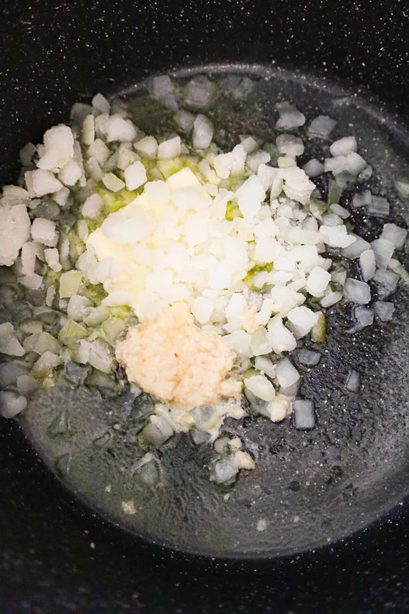 butter, diced onions and garlic puree in a large pot
