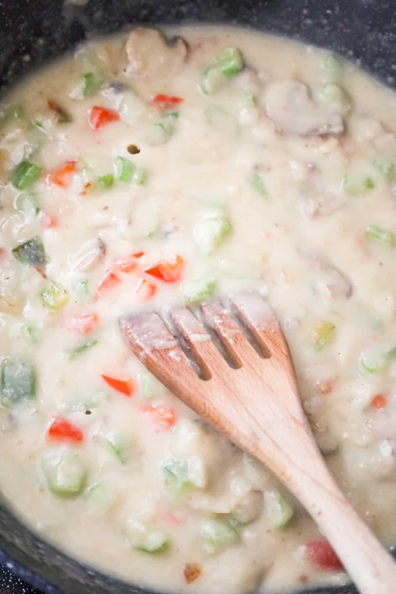 creamy vegetable mixture cooking in a skillet