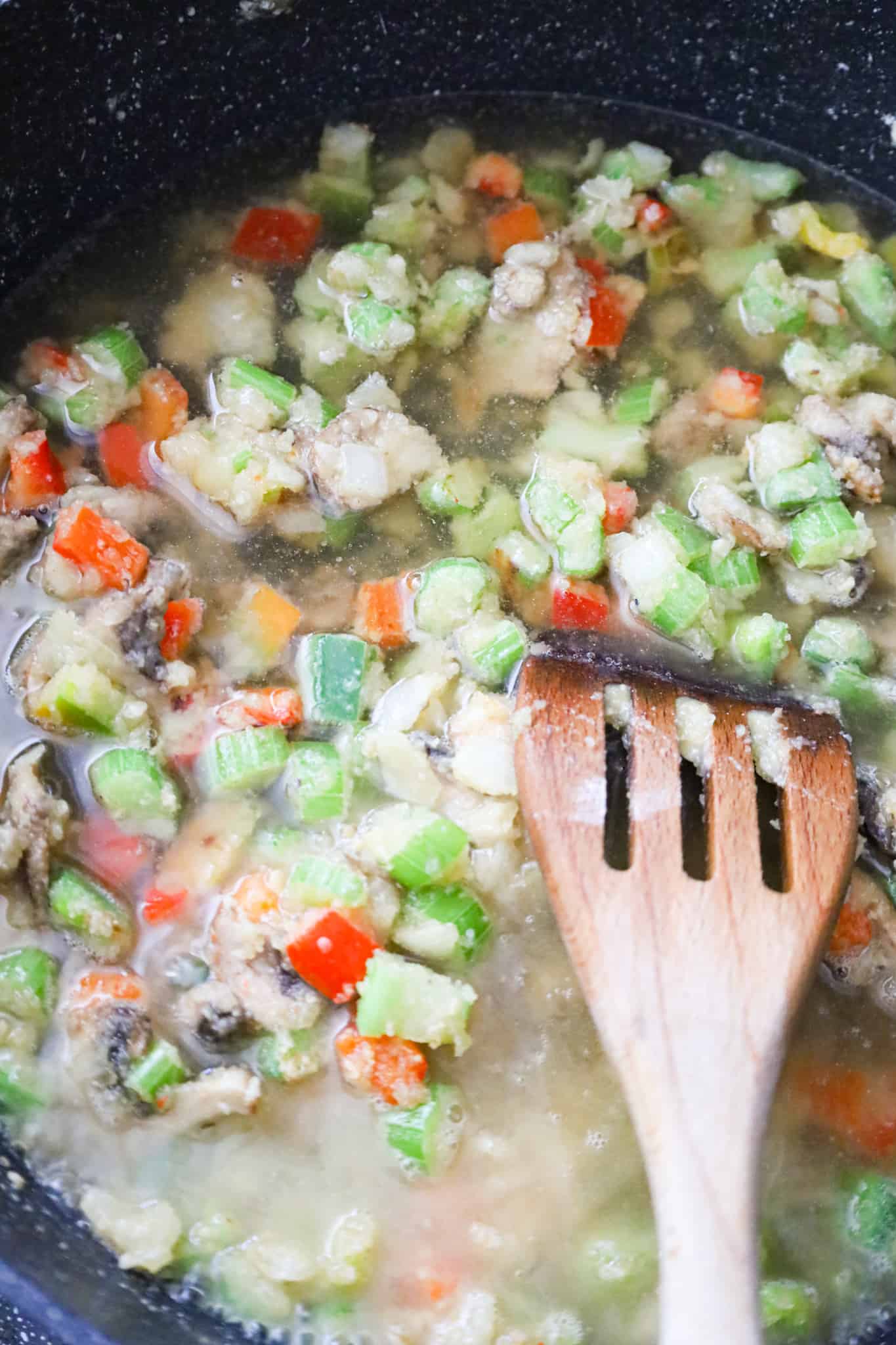 chicken broth added to skillet with flour and vegetable mixture