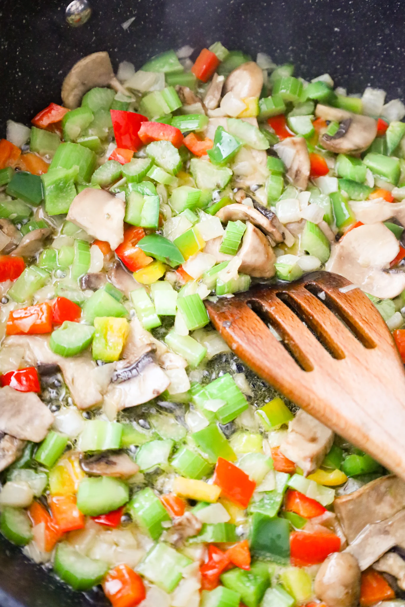 diced vegetables cooking in a skillet
