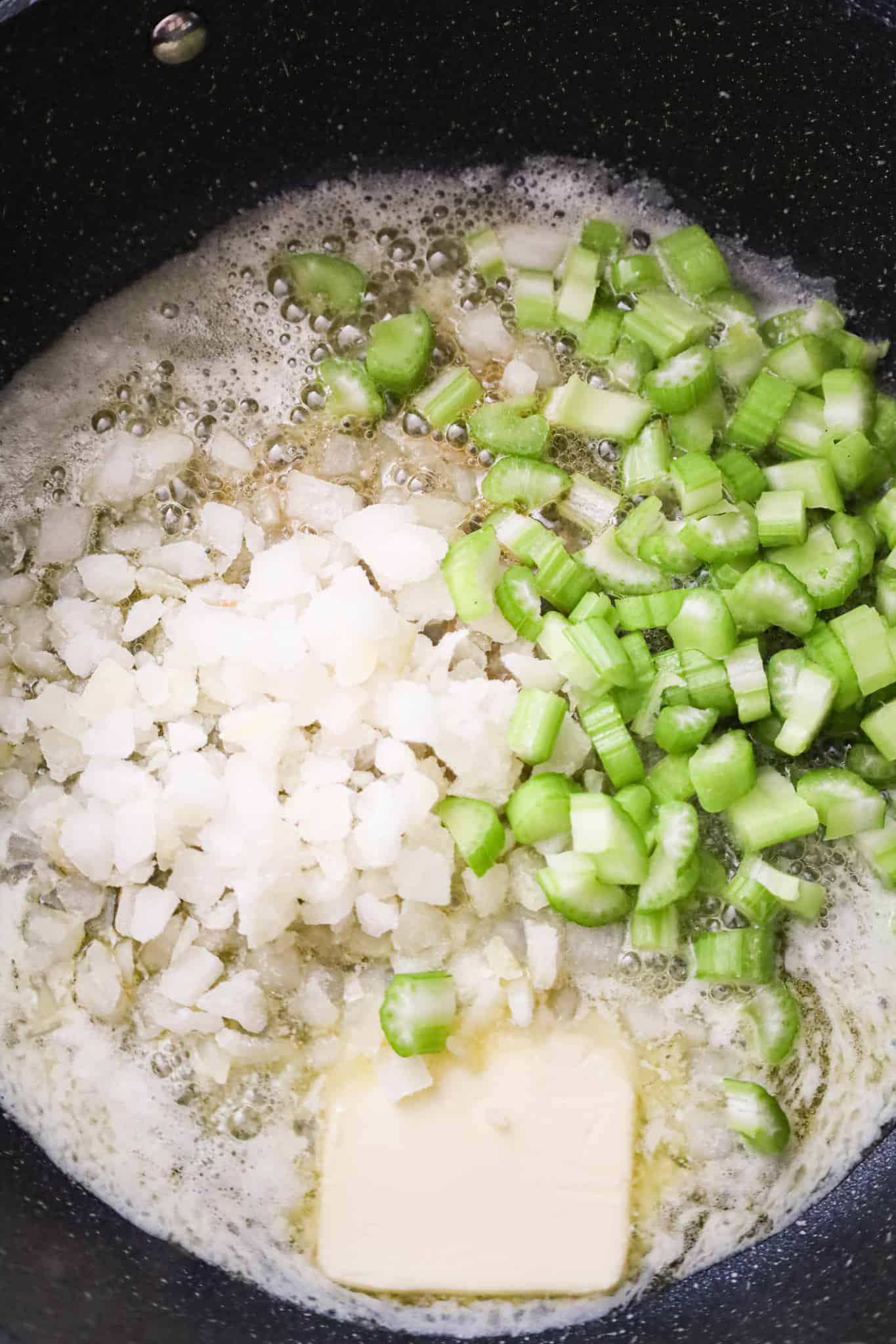 melted butter, diced onions and diced celery in a skillet
