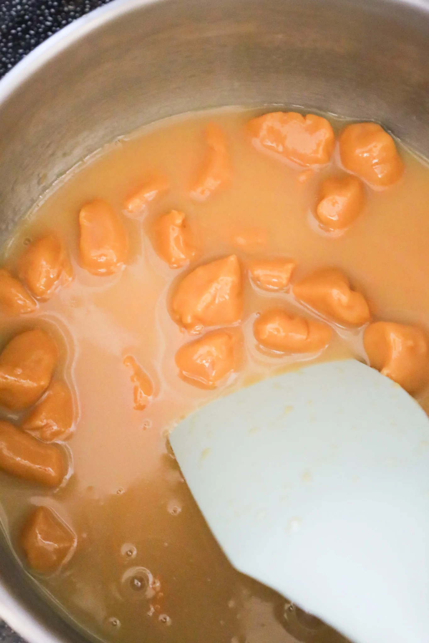 caramels melting in a sauce pot