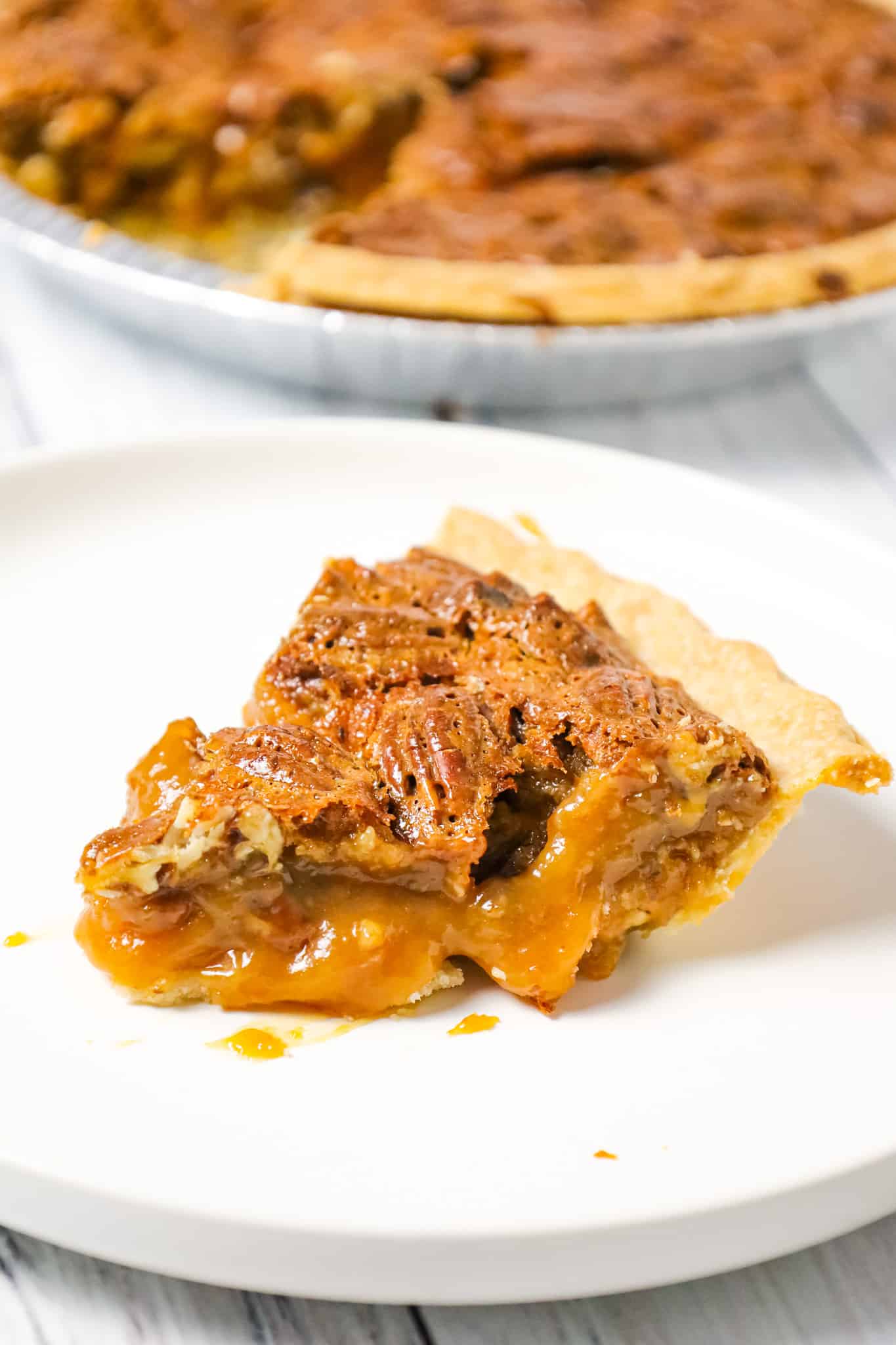 Caramel Pecan Pie is a decadent dessert recipe made with a store bought pie crust, Kraft caramels and pecan halves.