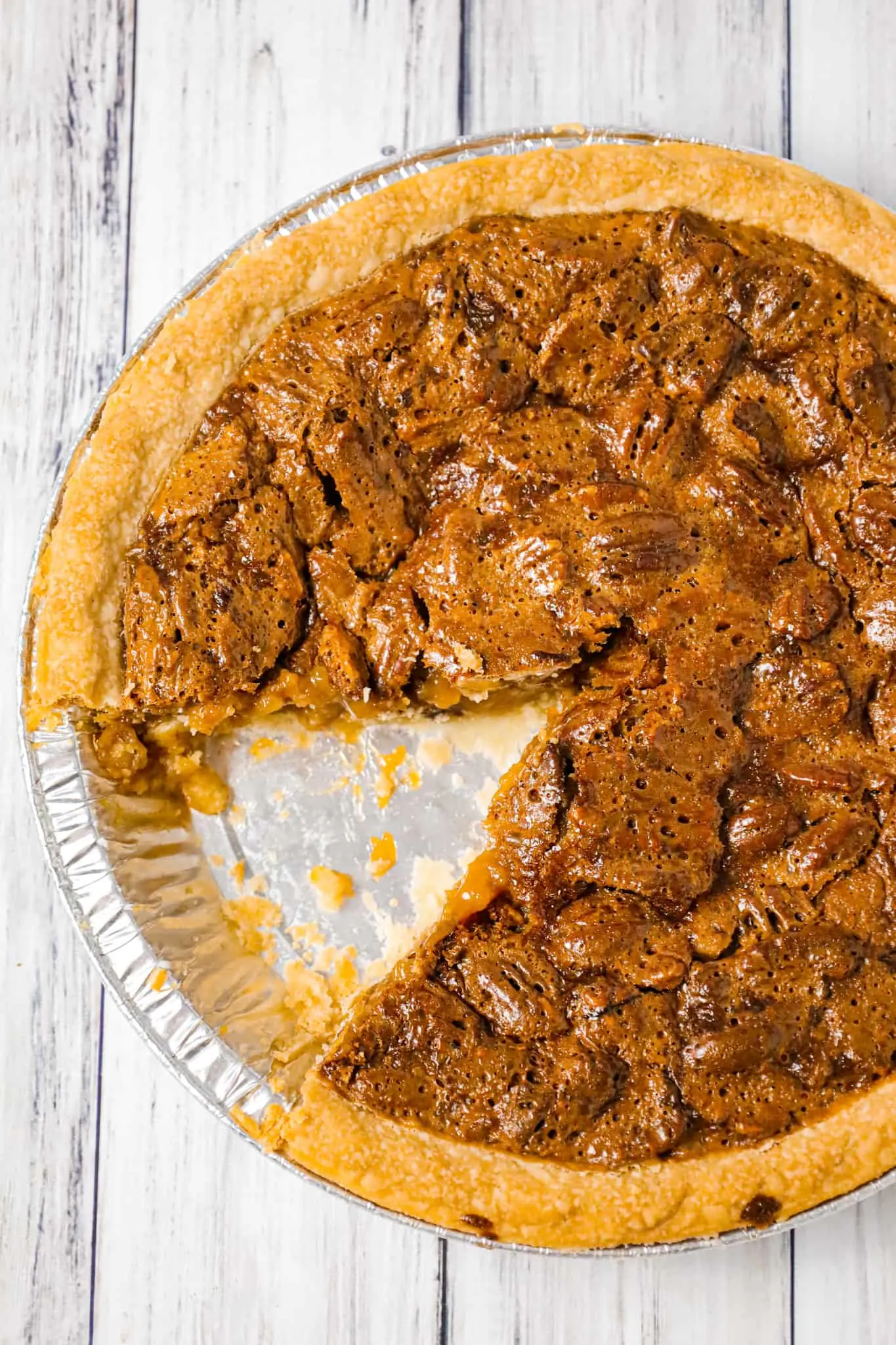 Caramel Pecan Pie is a decadent dessert recipe made with a store bought pie crust, Kraft caramels and pecan halves.